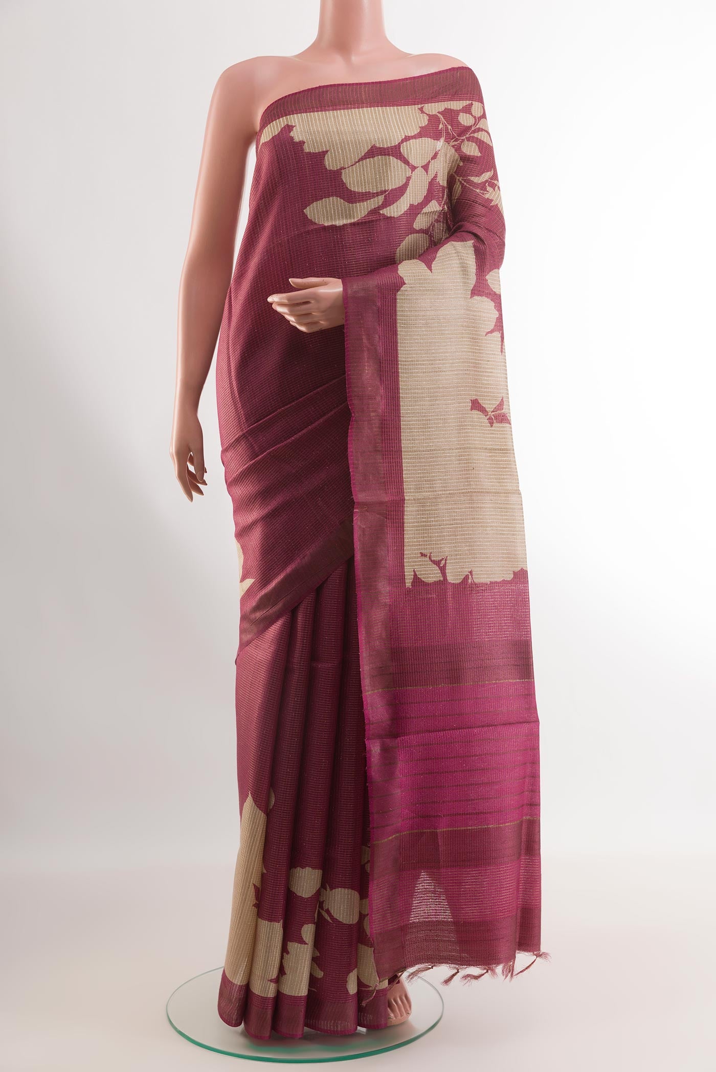 Pink Tussar Silk Saree with Printed design on the body and Printed Border.  displayed on a mannequin