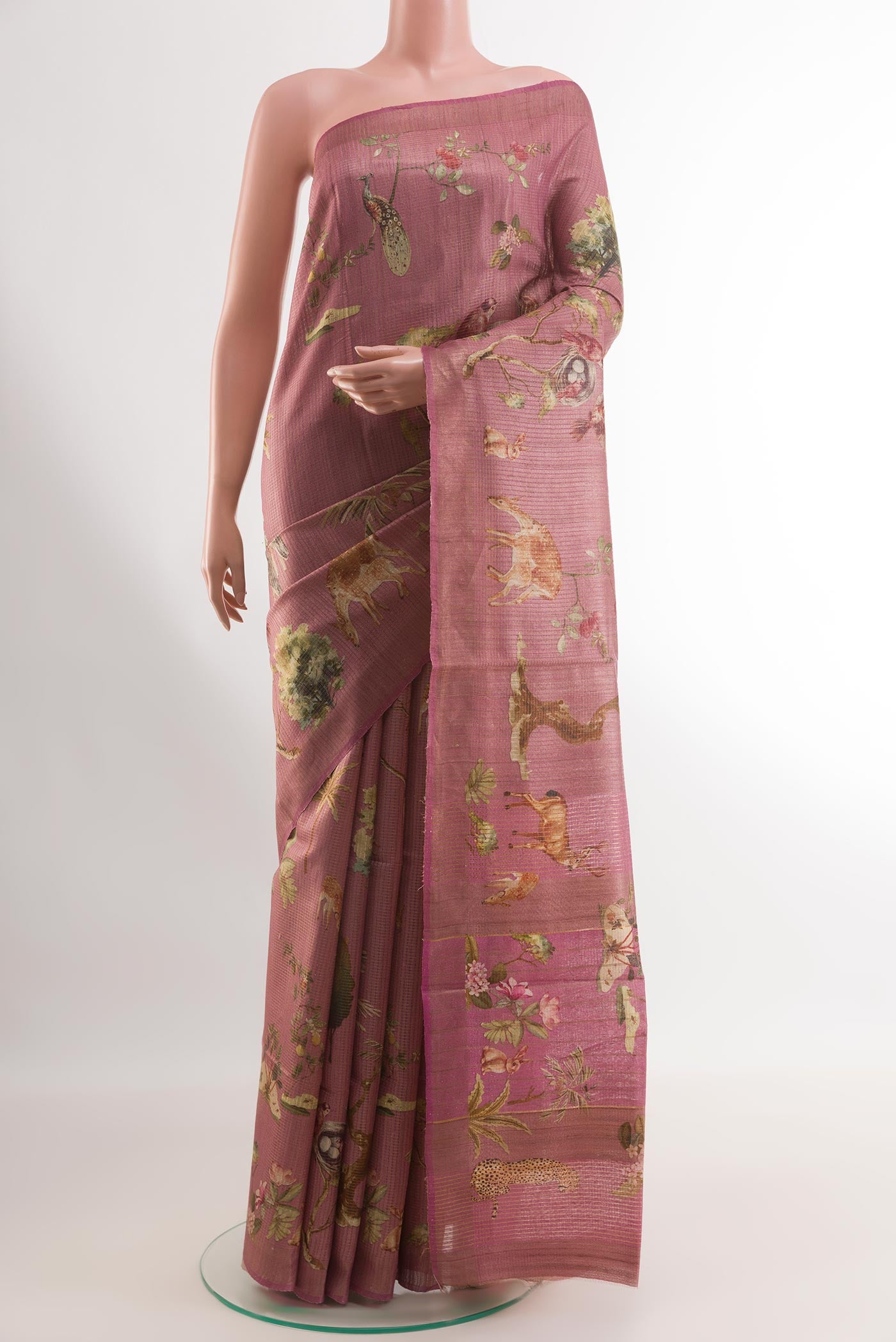 Pink Tussar Silk Saree with Printed design on the body and Printed Border.  displayed on a mannequin