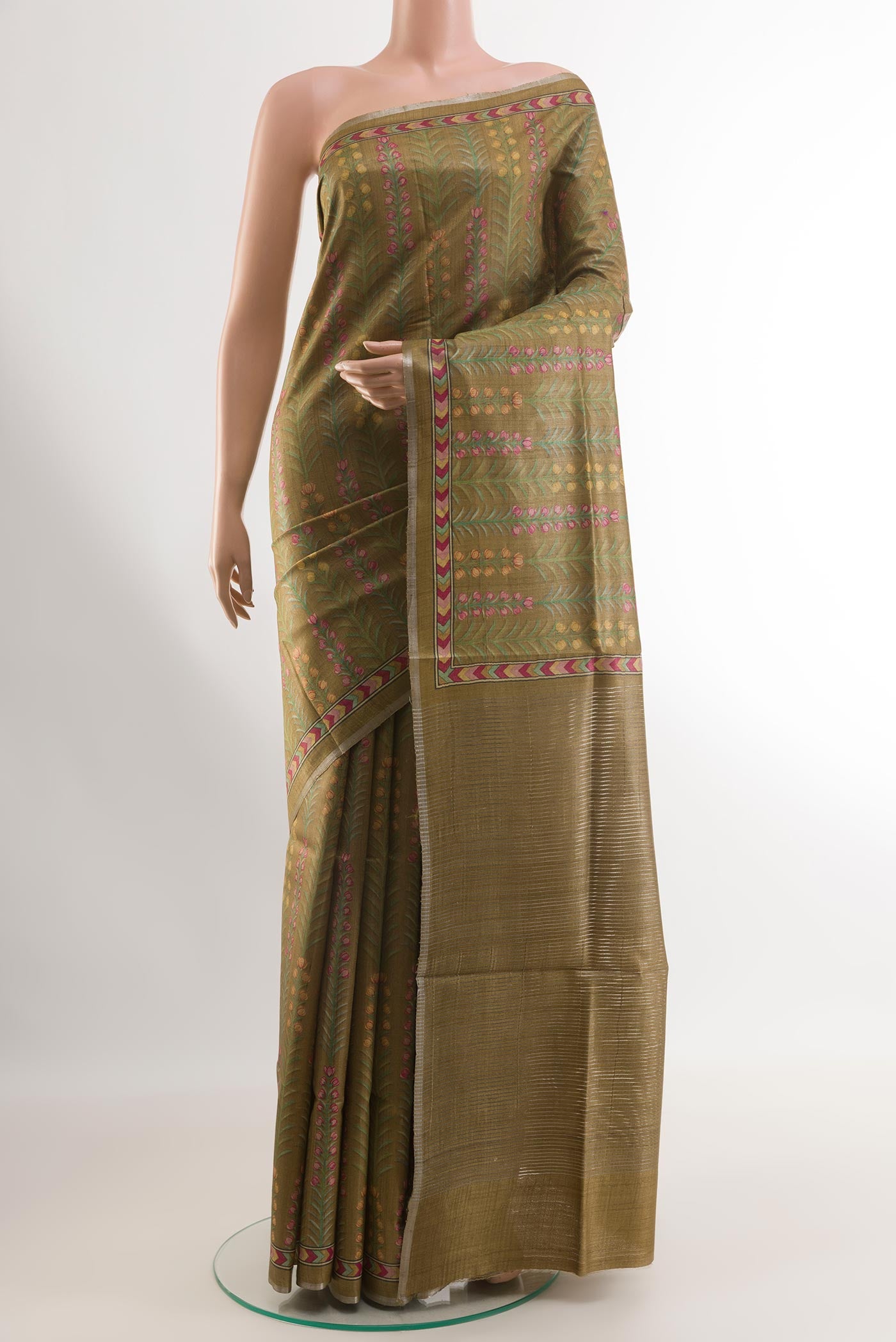 Mehandi Green Tussar Silk Saree with Printed design on the body and Printed Border.  displayed on a mannequin