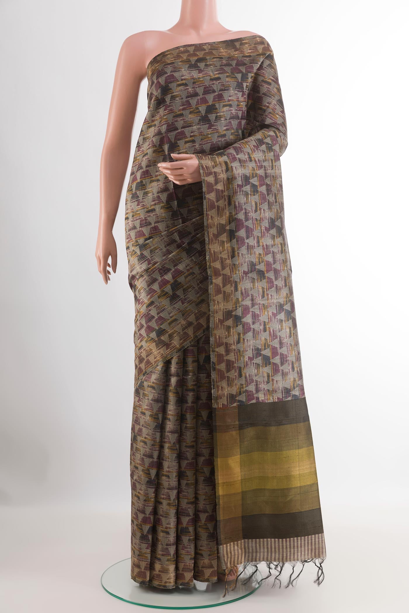 Multi Color Tussar Saree with Printed design on the body and Zari Border.  displayed on a mannequin
