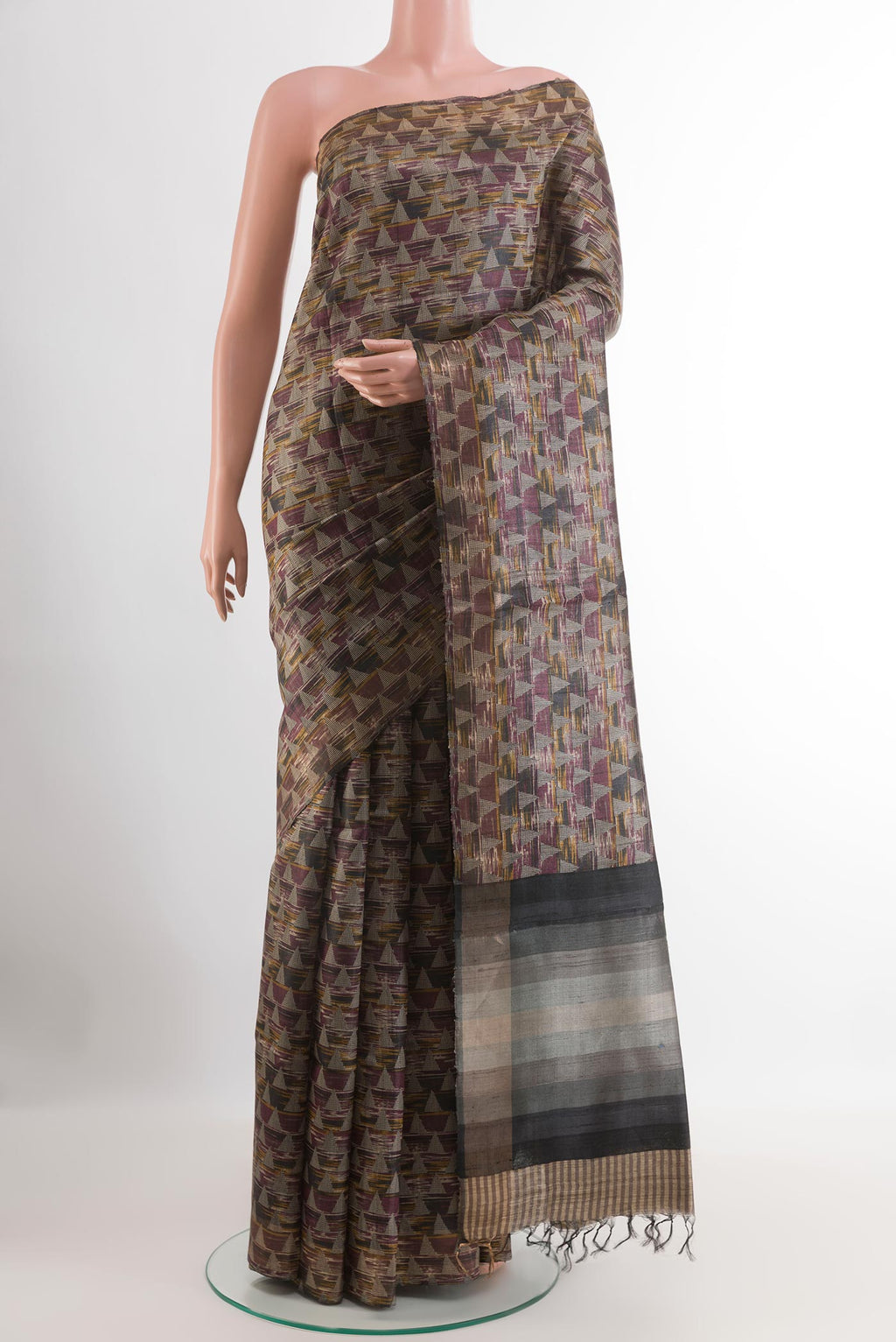 Multi Color Tussar Saree with Printed design on the body and Zari Border.  displayed on a mannequin
