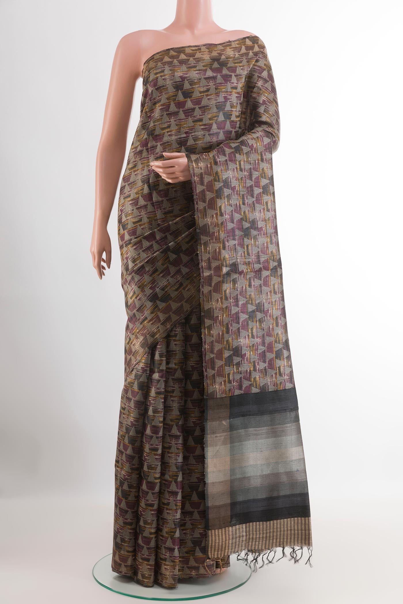 Multi Color Tussar Saree with Printed design on the body and Zari Border.  displayed on a mannequin