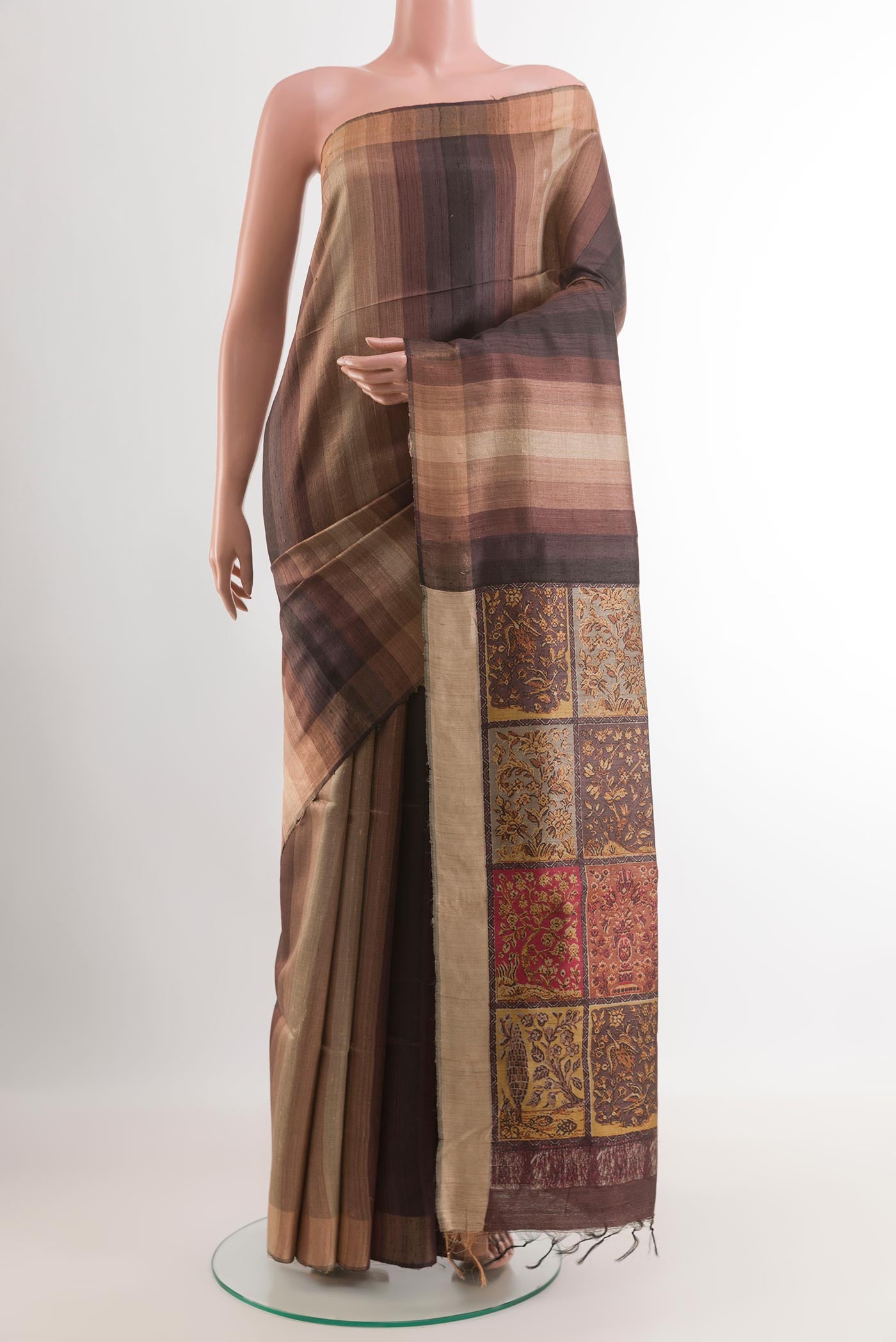 Brown Tussar Saree with Stripes on the body and Zari Border.  displayed on a mannequin