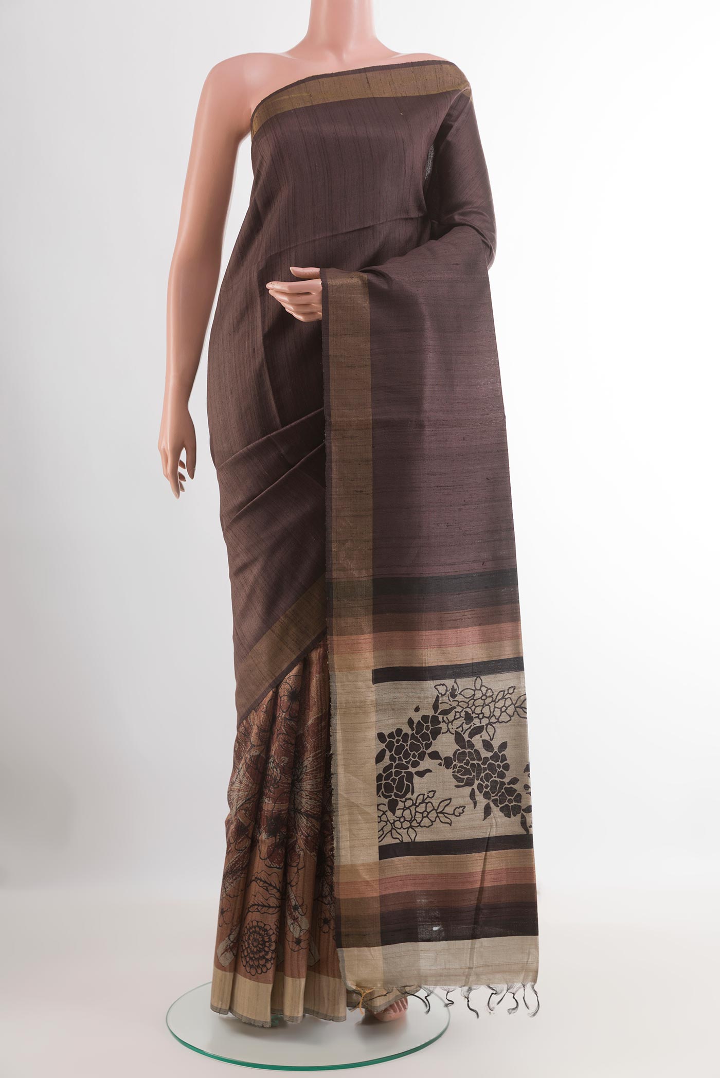 Brown Tussar Saree with Plain Body and Zari Border.  displayed on a mannequin
