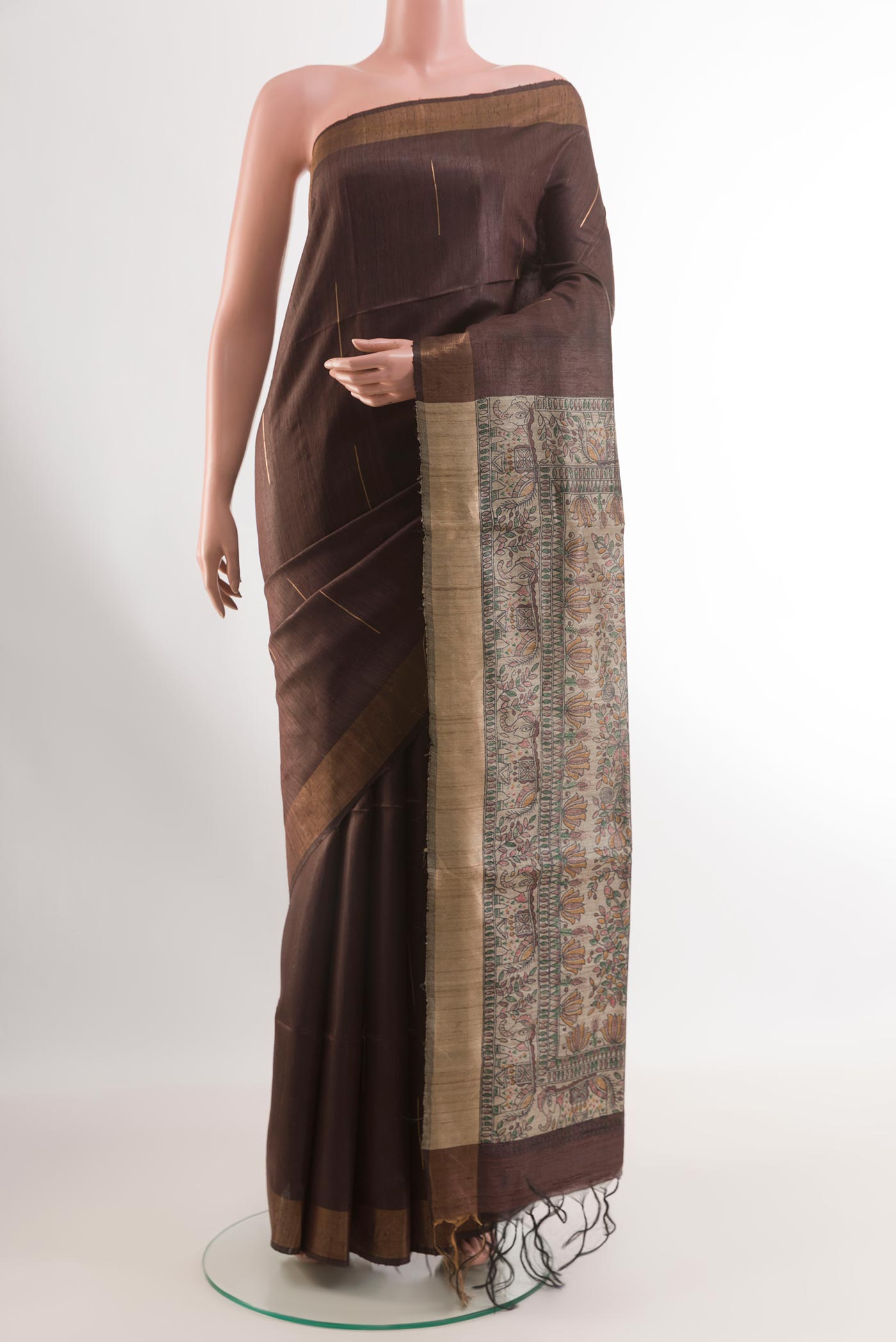 Brown Tussar Silk Saree with Stripes on the body and Printed Border.  displayed on a mannequin