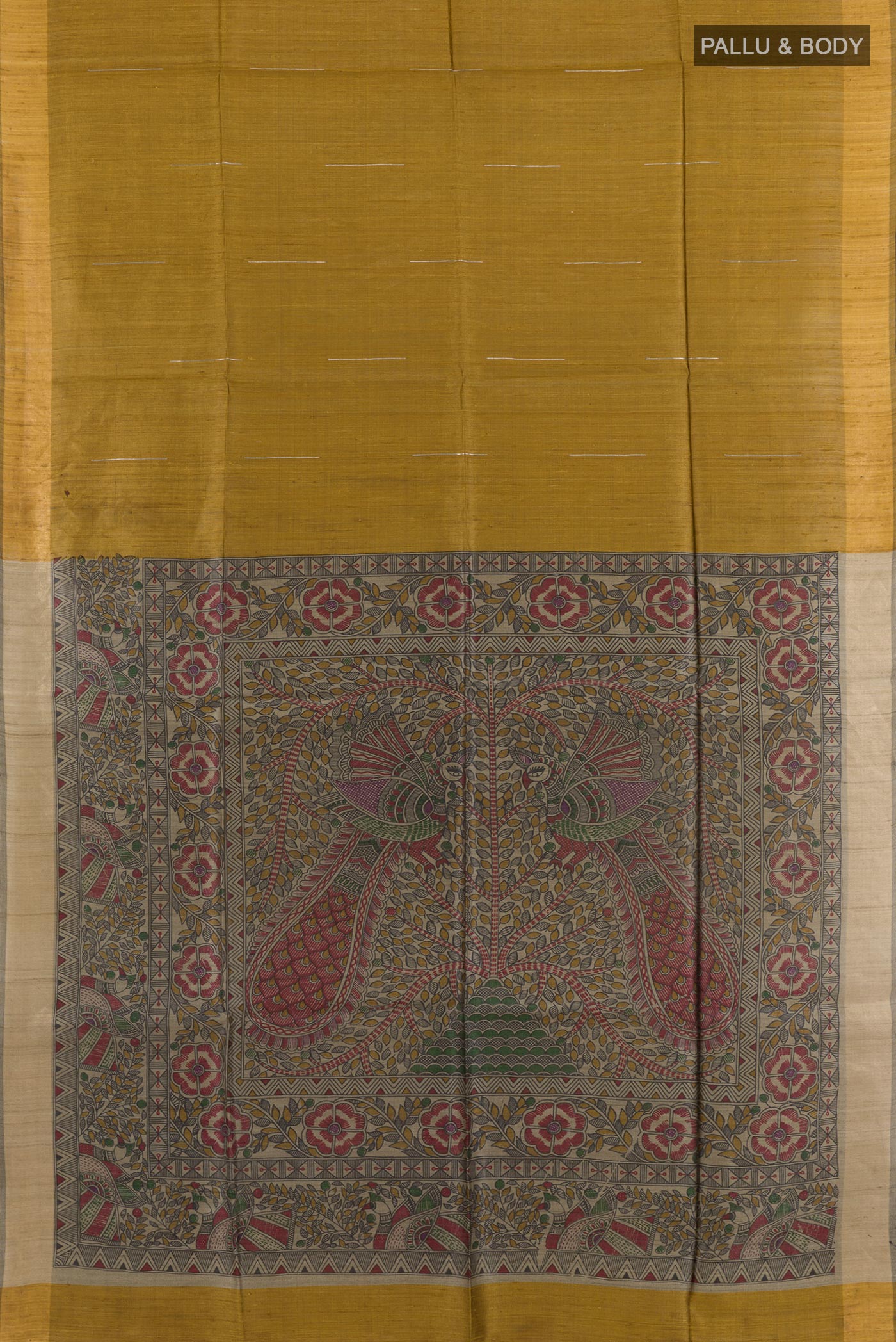 Flat view of Mustard Tussar Saree with Printed design on the body and Zari Border. 