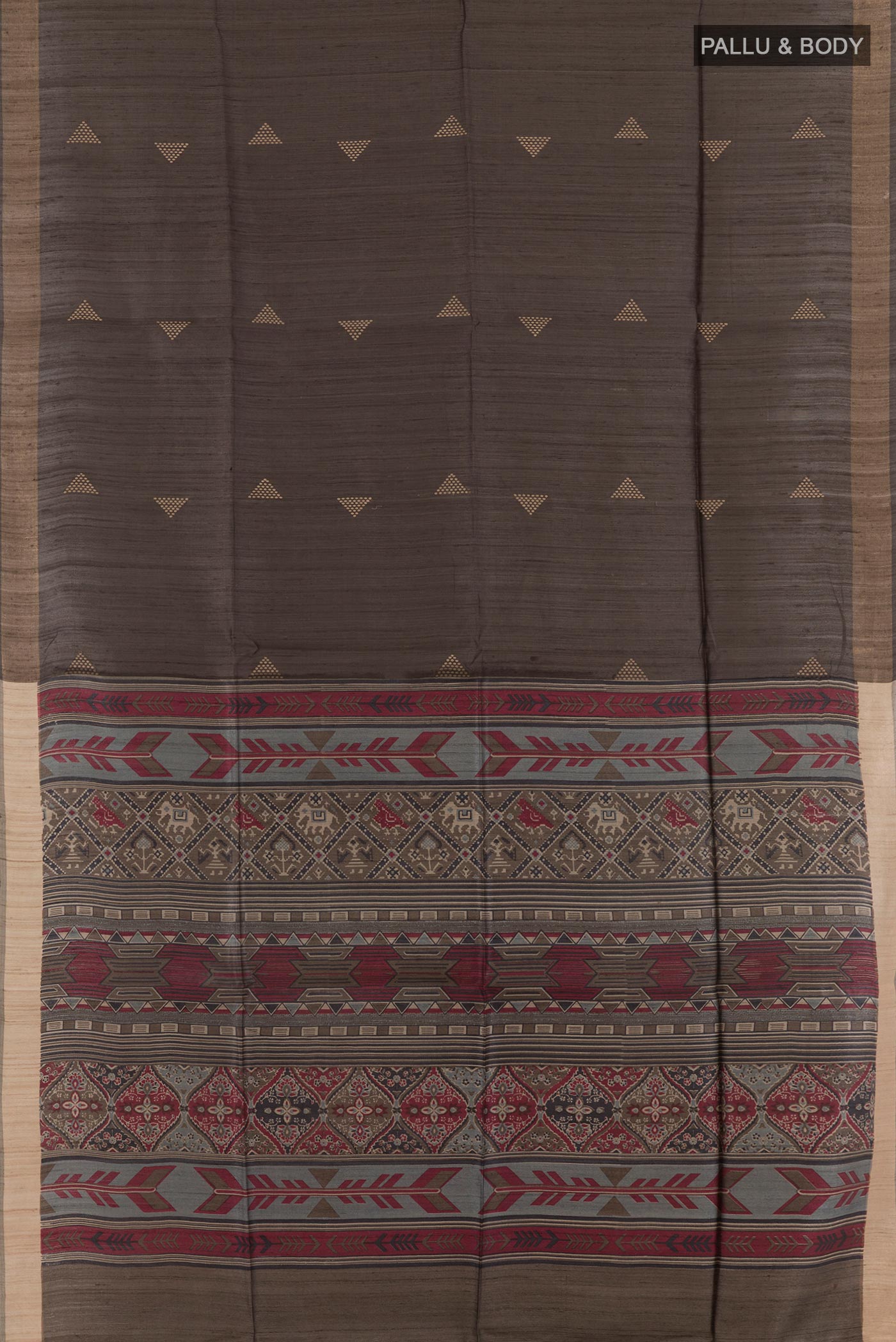 Flat view of Grey Tussar Saree with Printed design on the body and Zari Border. 