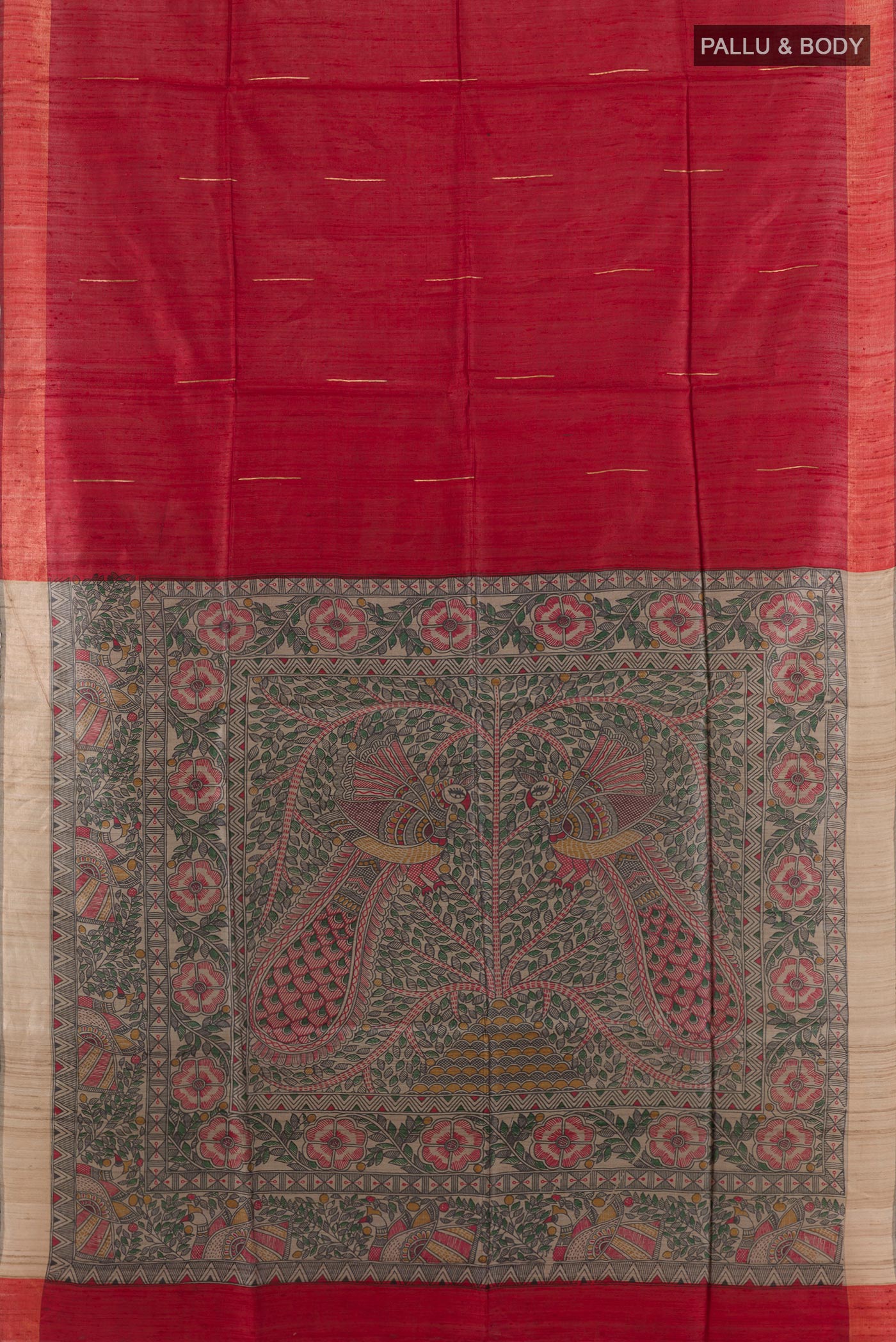 Flat view of Red Tussar Saree with Printed design on the body and Zari Border. 