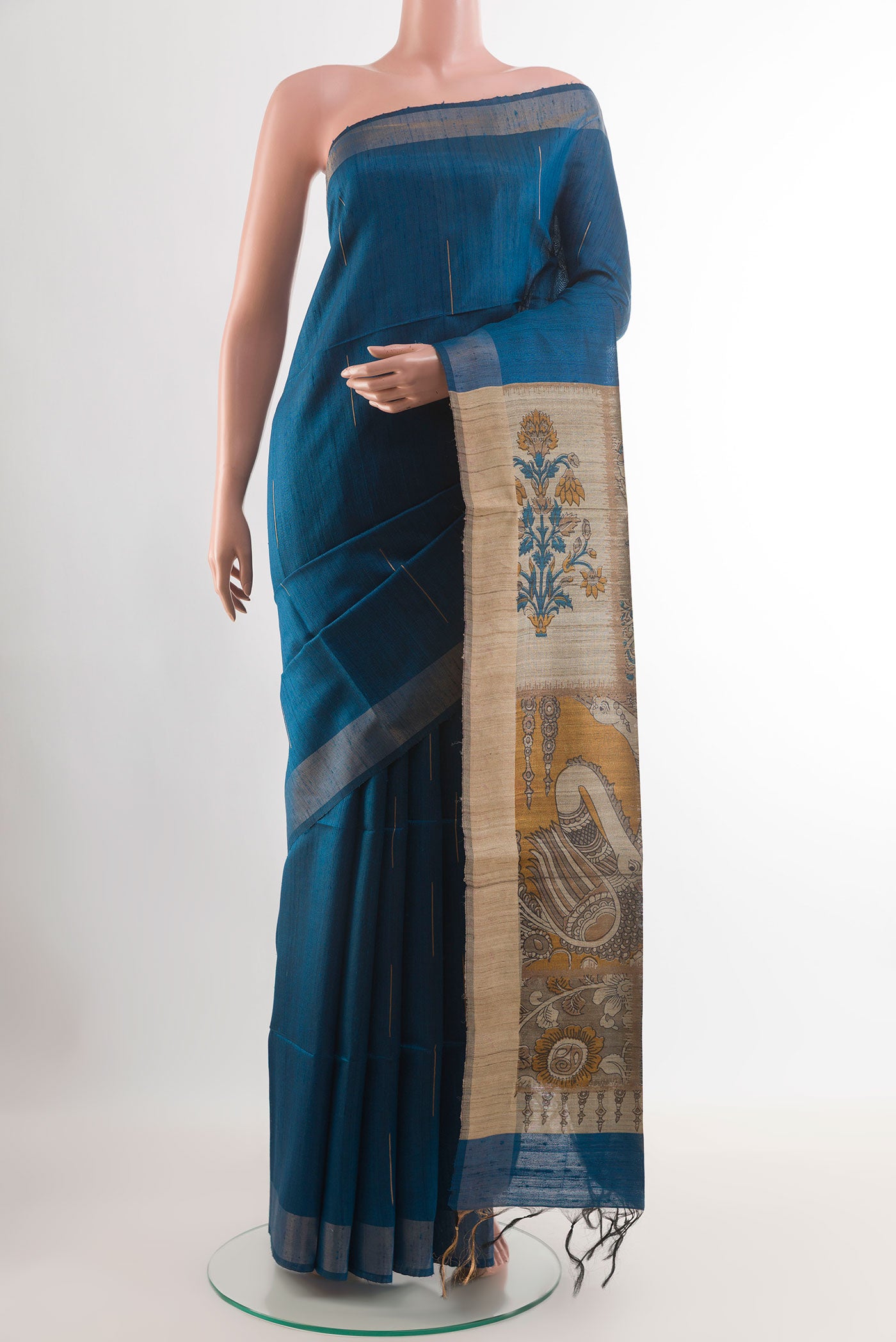 Blue Tussar Saree with Zari Butta on the body and Zari Border.  displayed on a mannequin