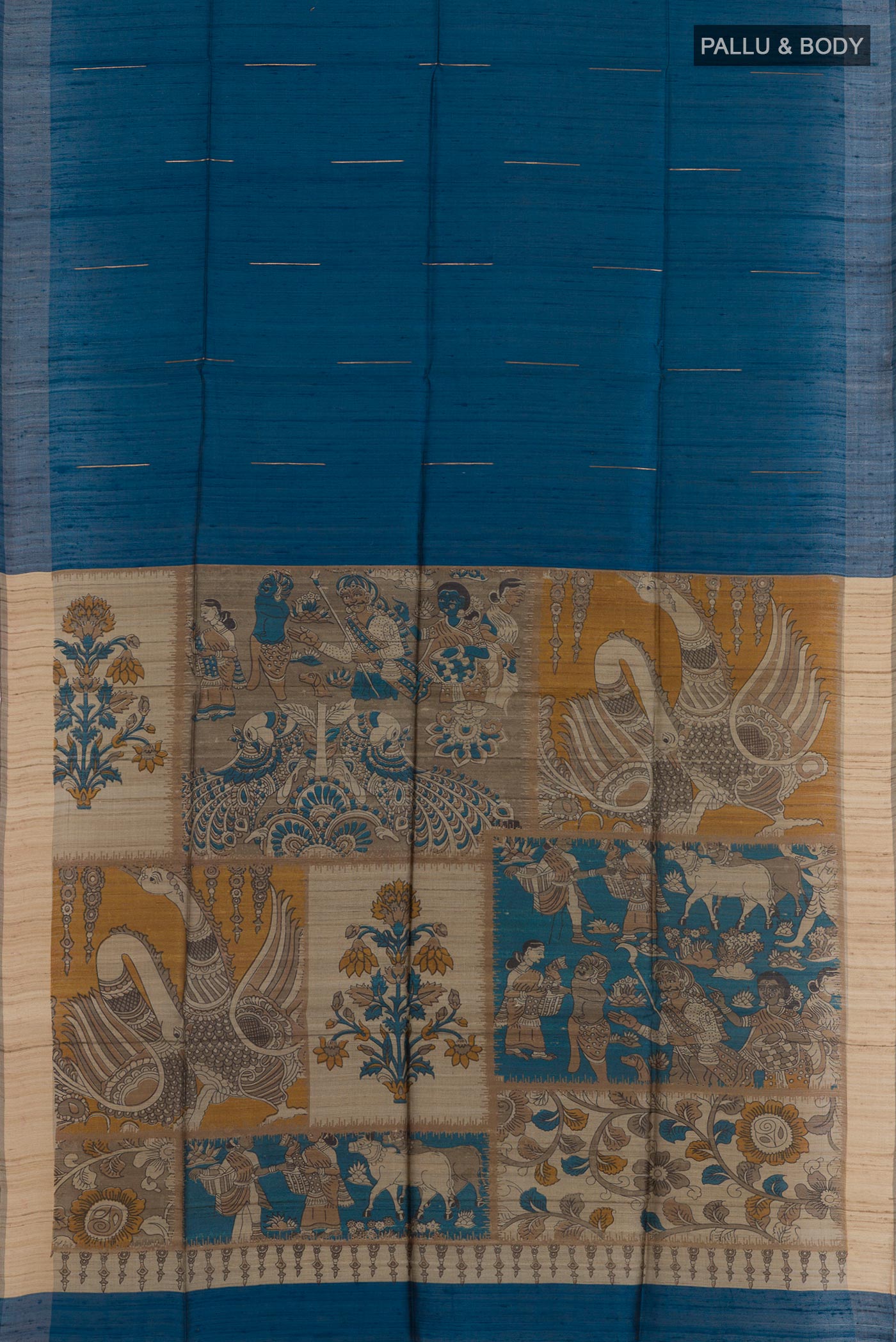 Flat view of Blue Tussar Saree with Zari Butta on the body and Zari Border. 