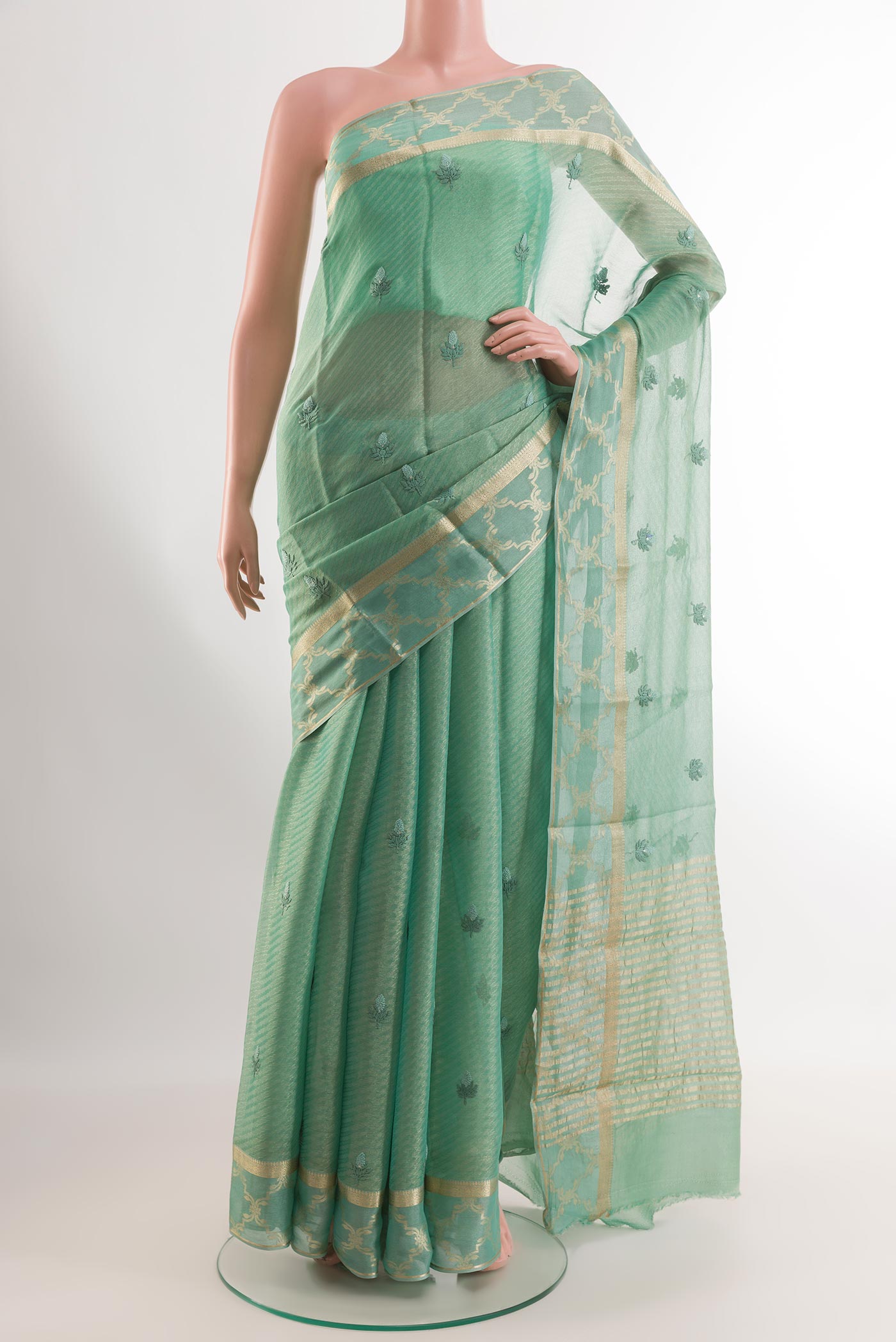 Sea Green Mysore Georgette Saree with Embroidery on the body and Printed Border.  displayed on a mannequin