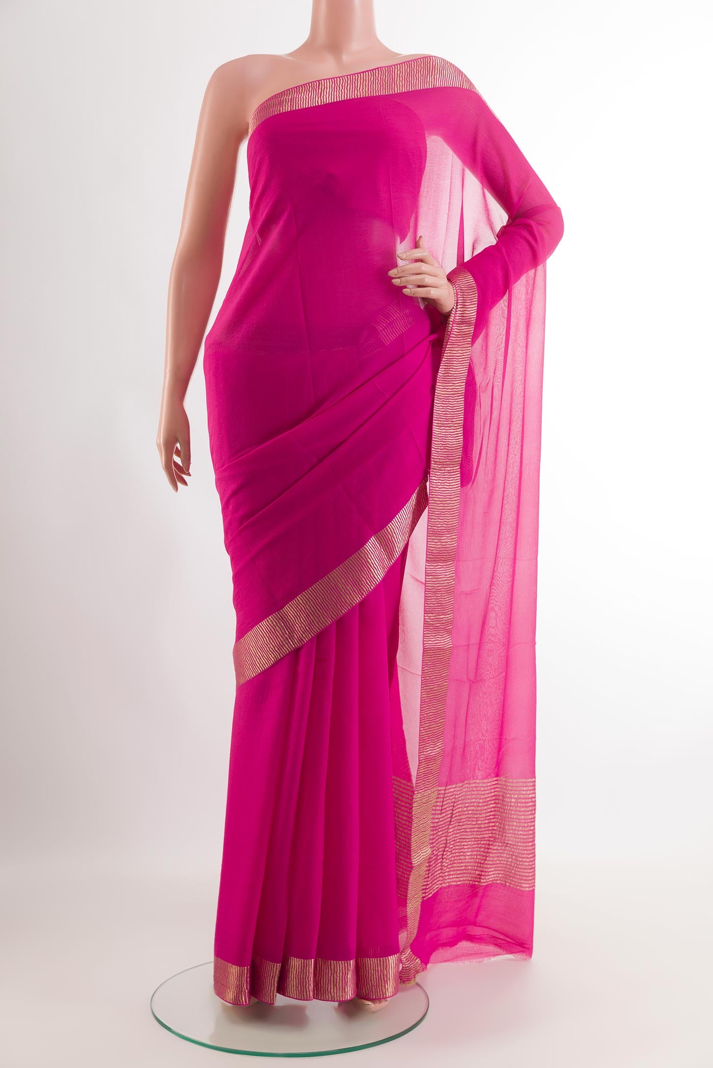 Pink Mysore Chiffon Saree with Zari Butta on the body and Zari Border.  displayed on a mannequin