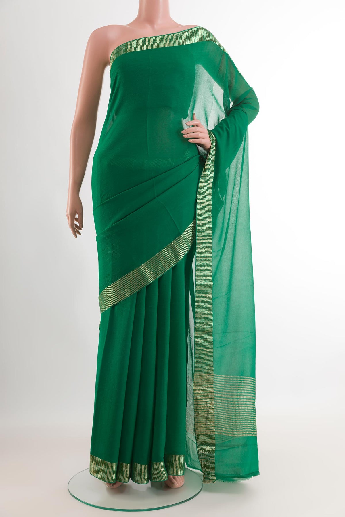 Green Mysore Chiffon Saree with Plain Body and Zari Border.  displayed on a mannequin