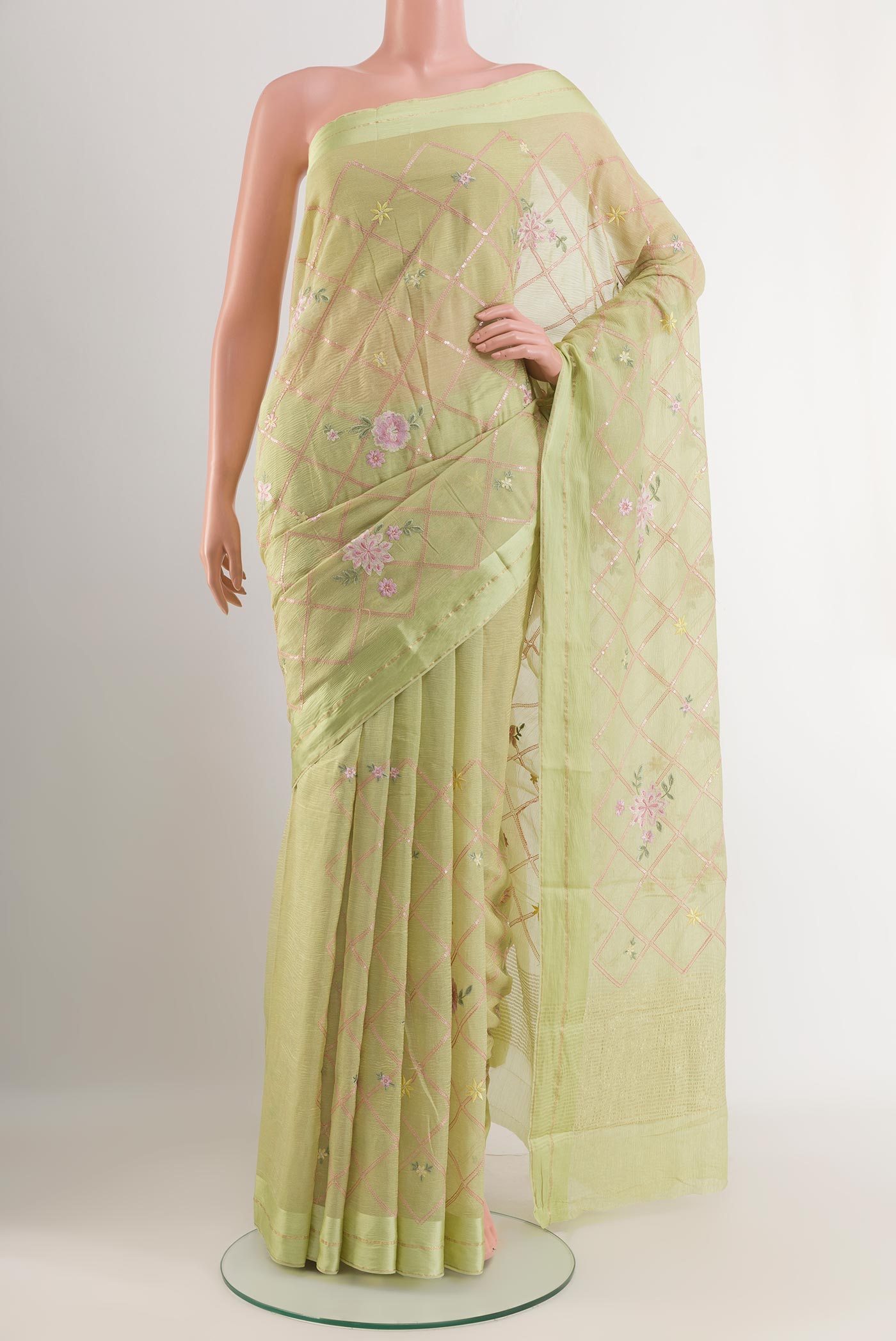 Light Green Mysore Chiffon Saree with Stripes on the body and Zari Border.  displayed on a mannequin