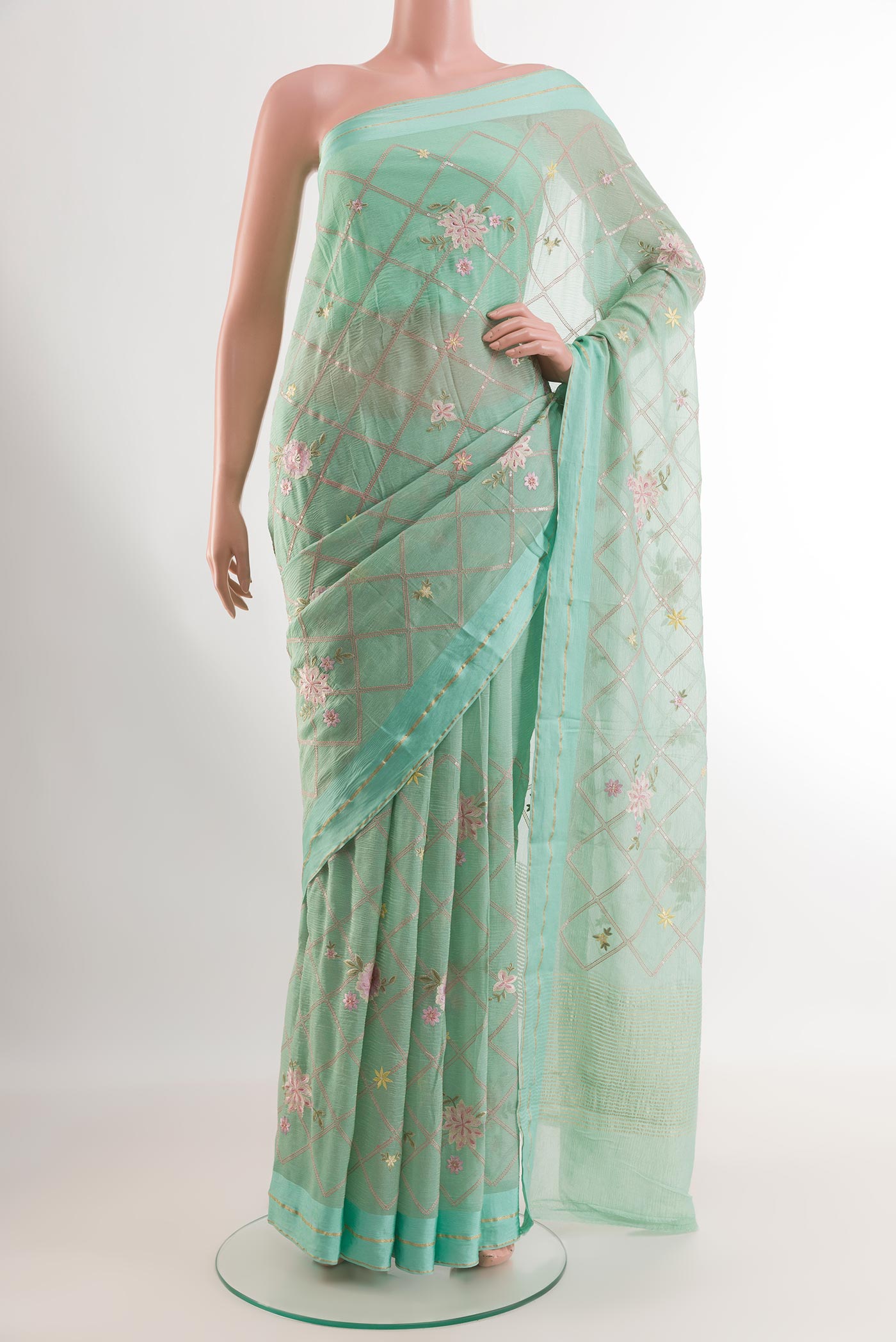 Sea Green Mysore Georgette Saree with Embroidery on the body and Printed Border.  displayed on a mannequin