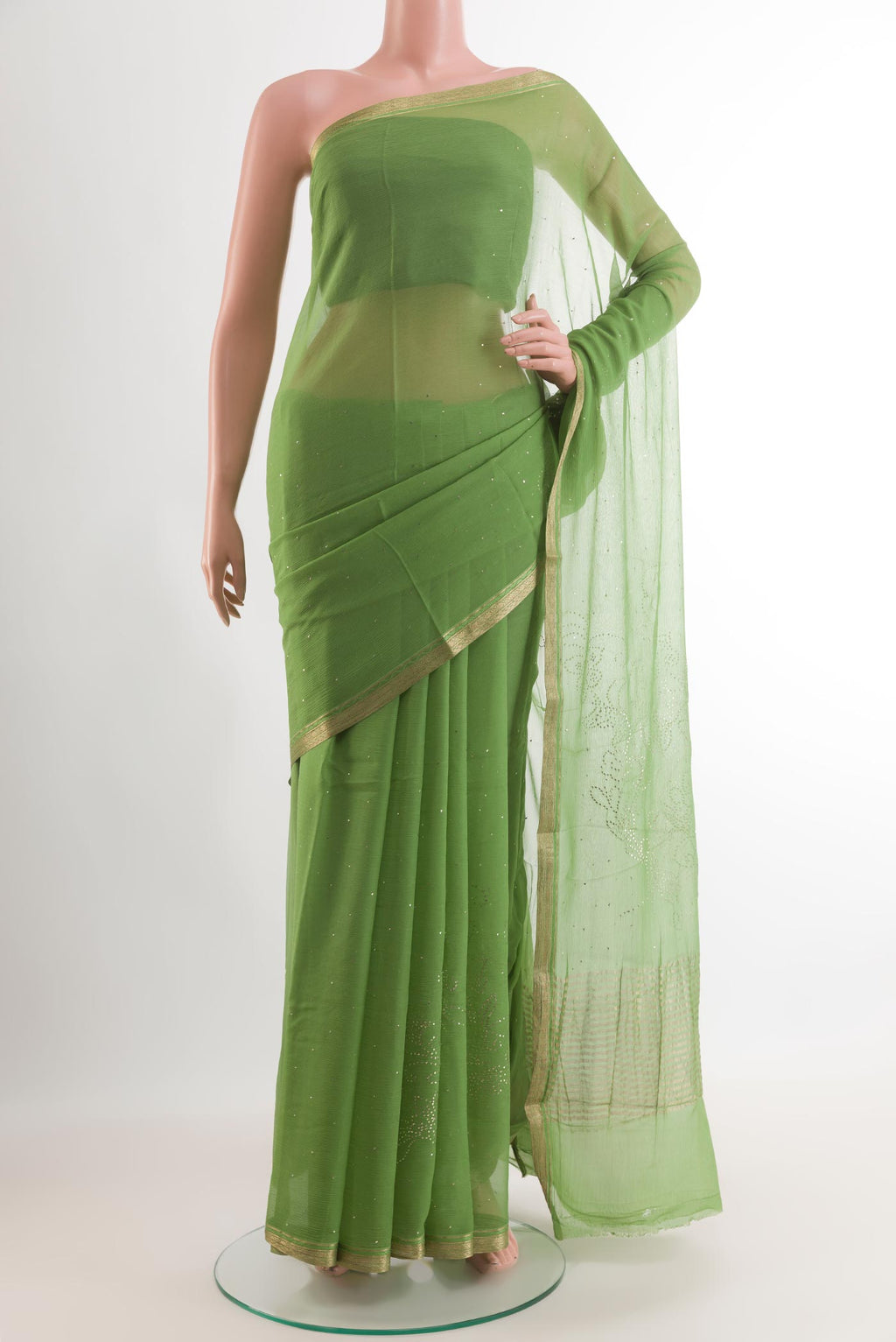 Green Mysore Chiffon Saree with Zari Butta on the body and Zari Border.  displayed on a mannequin