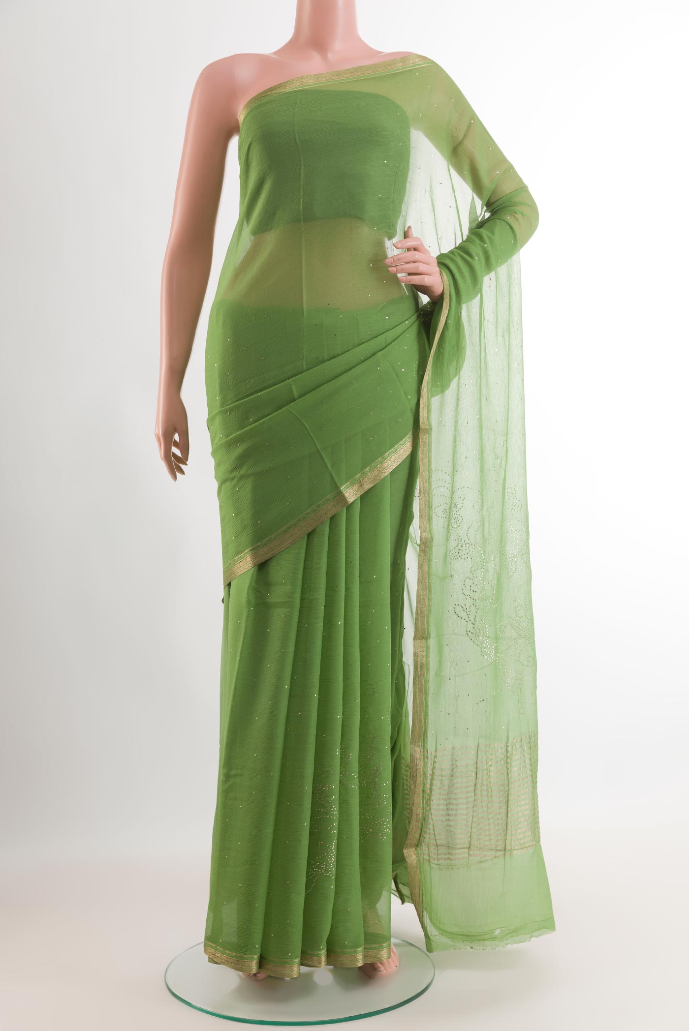 Green Mysore Chiffon Saree with Zari Butta on the body and Zari Border.  displayed on a mannequin