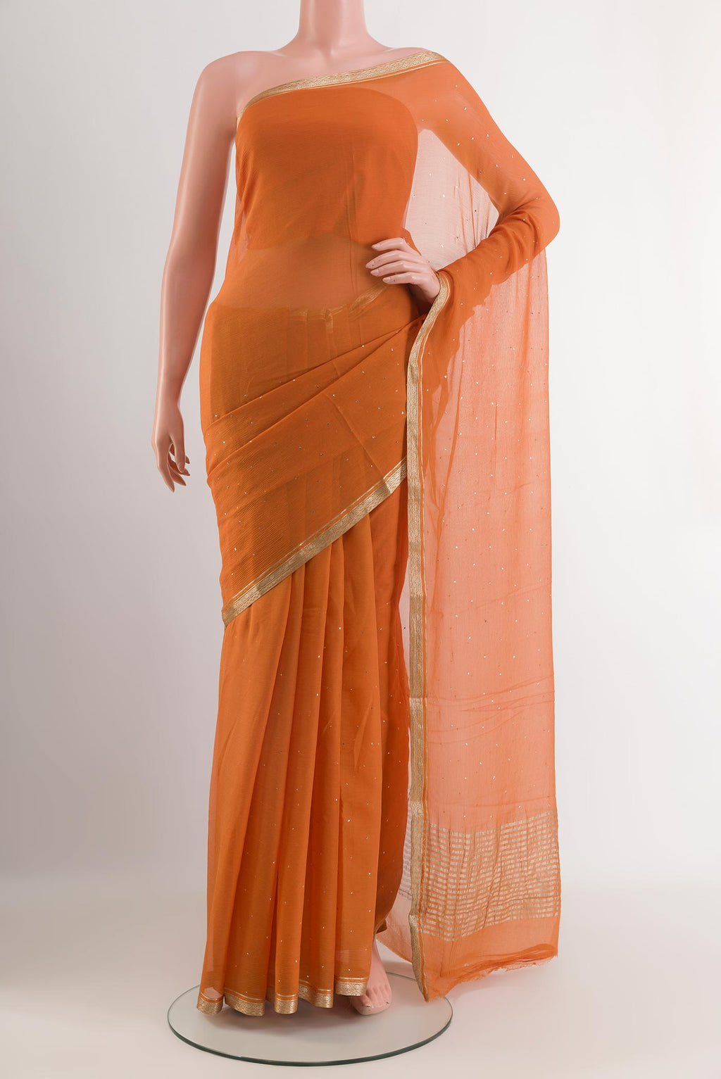 Orange Mysore Chiffon Saree with Zari Butta on the body and Zari Border.  displayed on a mannequin