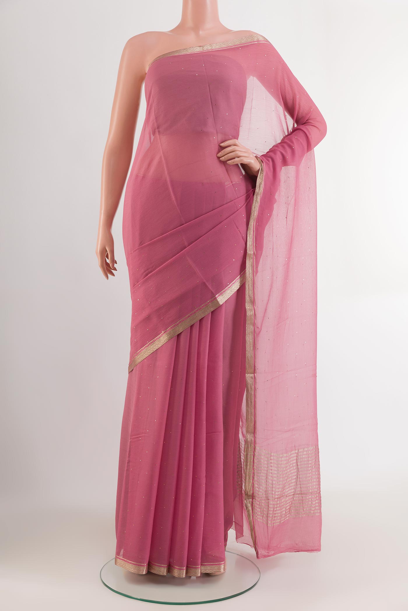 Pink Mysore Chiffon Saree with Zari Butta on the body and Zari Border.  displayed on a mannequin