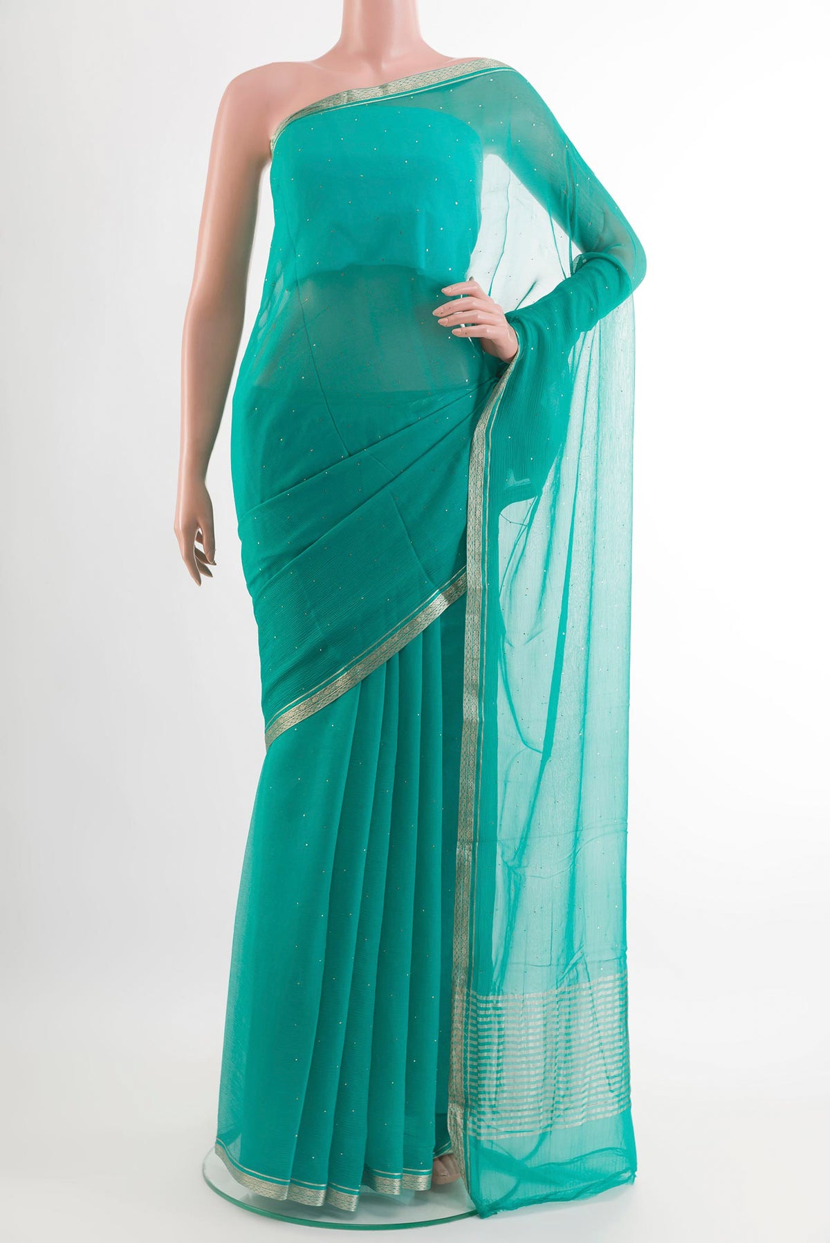 Sea Green Mysore Chiffon Saree with Zari Butta on the body and Plain Border.  displayed on a mannequin