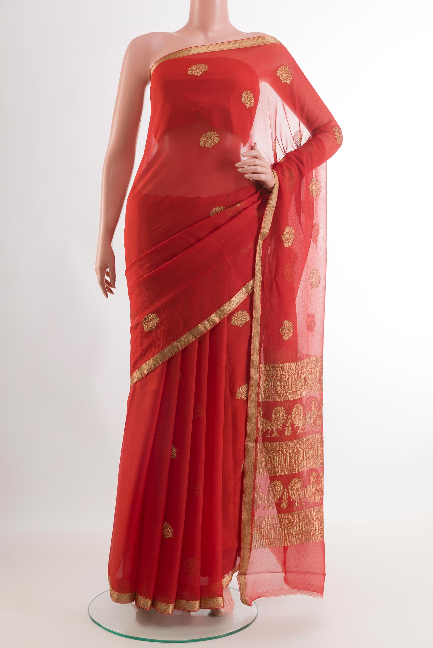 Orange Mysore Chiffon Saree with Zari Butta on the body and Zari Border.  displayed on a mannequin