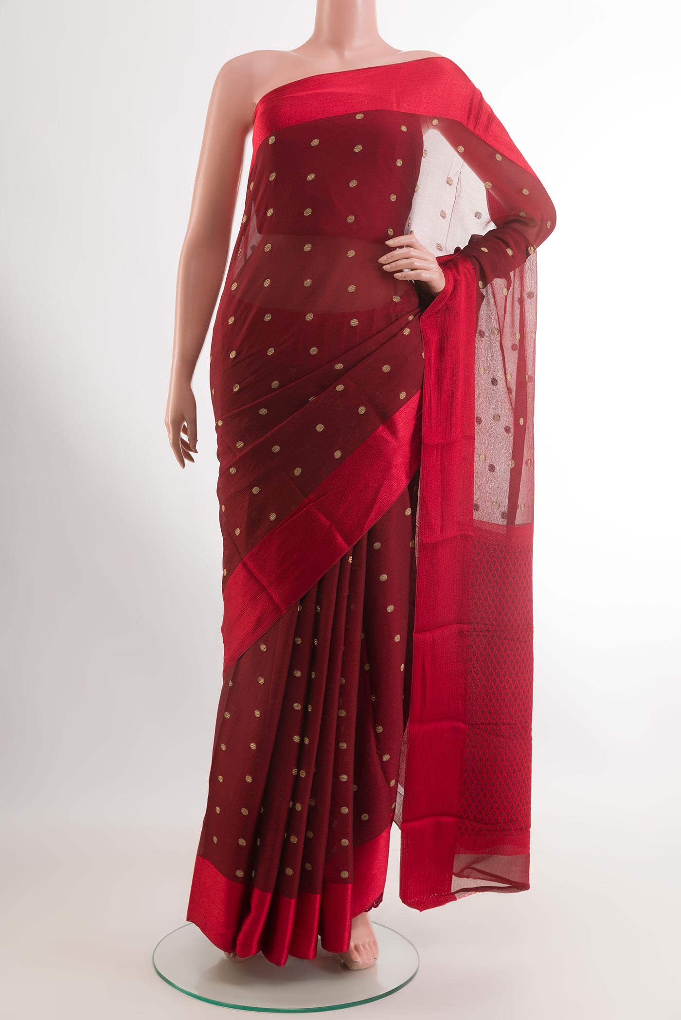 Red Mysore Chiffon Saree with Zari Butta on the body and Plain Border.  displayed on a mannequin