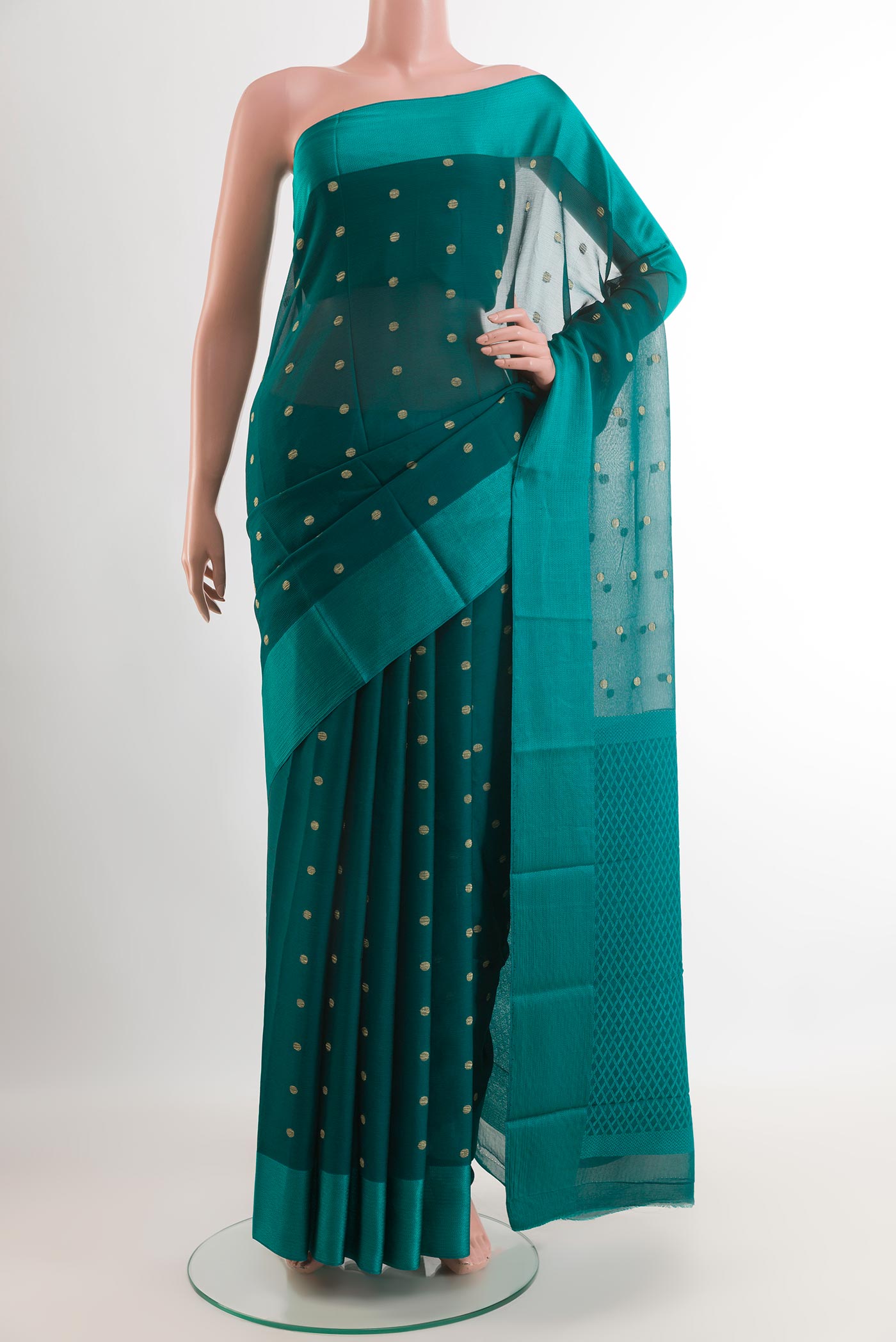 Sea Green Mysore Chiffon Saree with Zari Butta on the body and Zari Border.  displayed on a mannequin