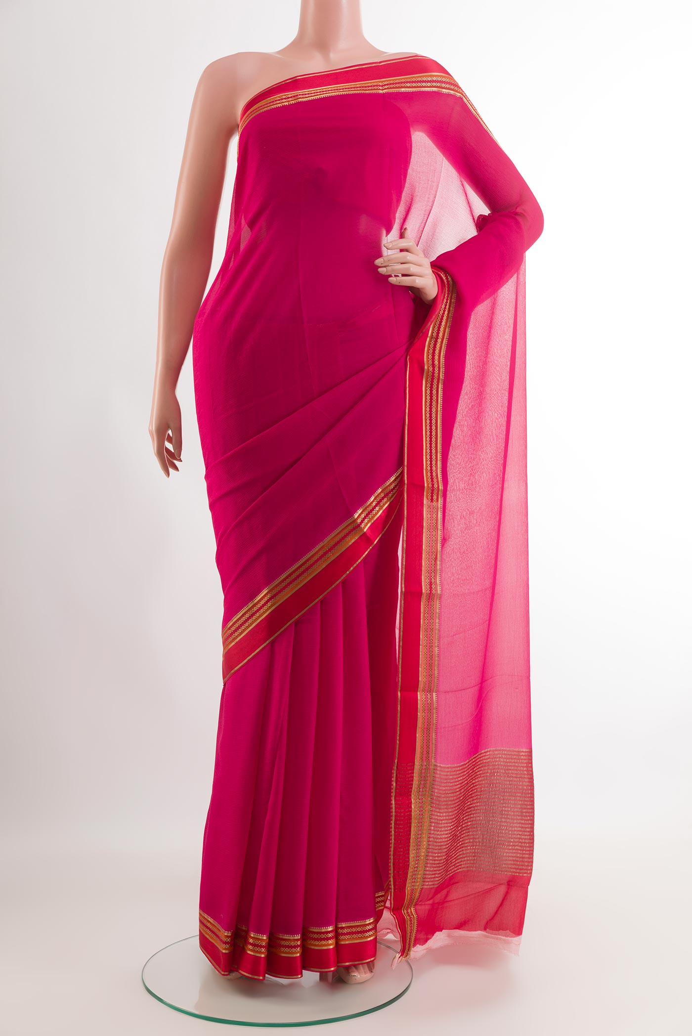 Pink Mysore Chiffon Saree with Zari Butta on the body and Zari Border.  displayed on a mannequin