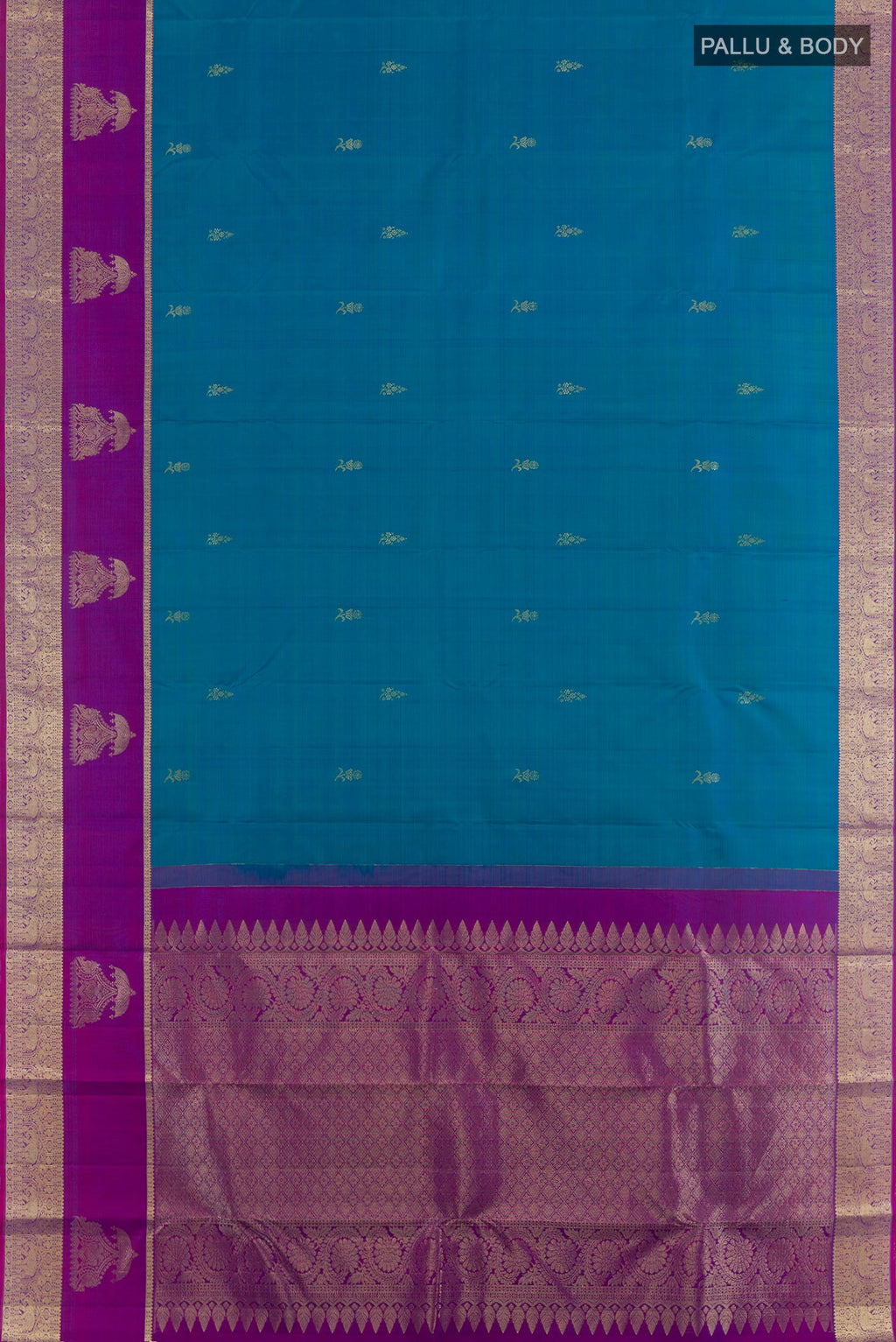 Flat view of Peacock Blue Tussar Silk Saree with Zari Butta on the body and Zari Border. 