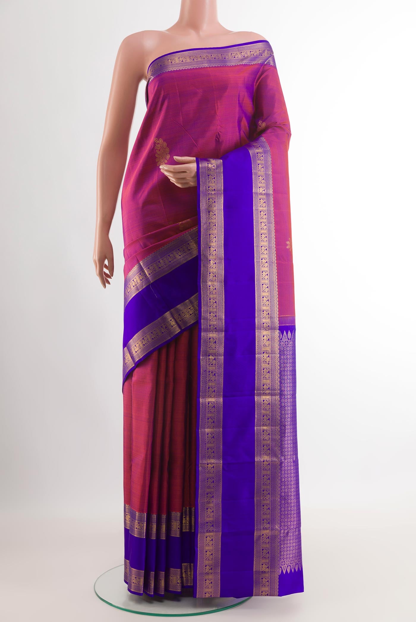 Light Magenta Kanchipuram Silk Saree with Zari Butta on the body and Zari Border.  displayed on a mannequin