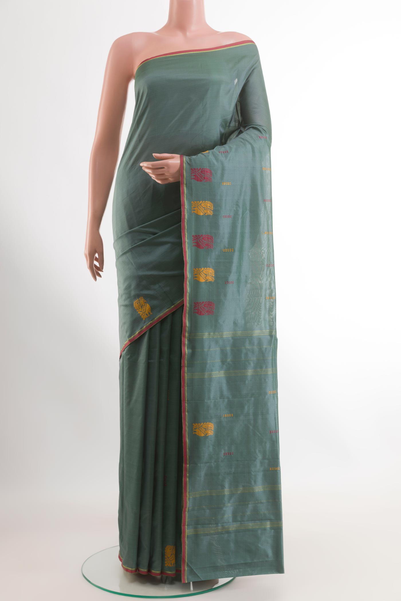 Grey Kanchipuram Silk Saree with Thread Butta on the body and Thread Border.  displayed on a mannequin