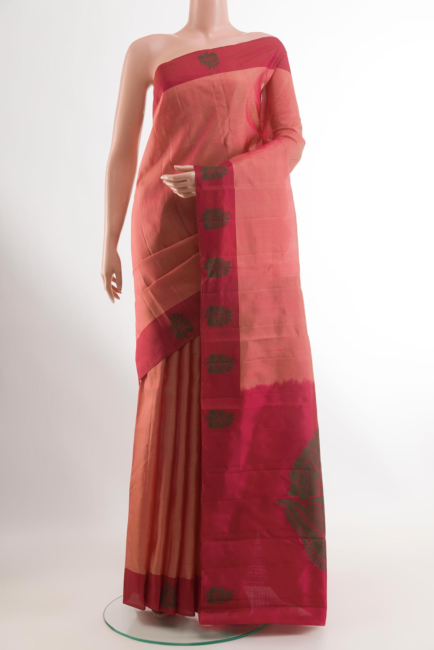 Peach Kanjivaram Silk Saree with Zari Butta on the body and Thread Border.  displayed on a mannequin