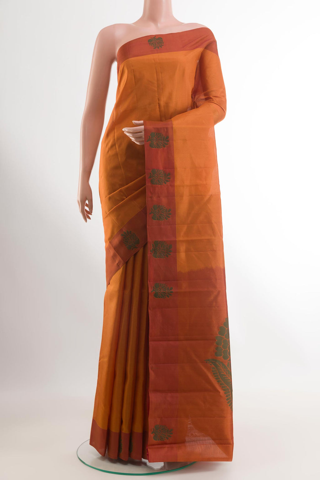 Brick Orange Kanjivaram Silk Saree with Zari Butta on the body and Thread Border.  displayed on a mannequin