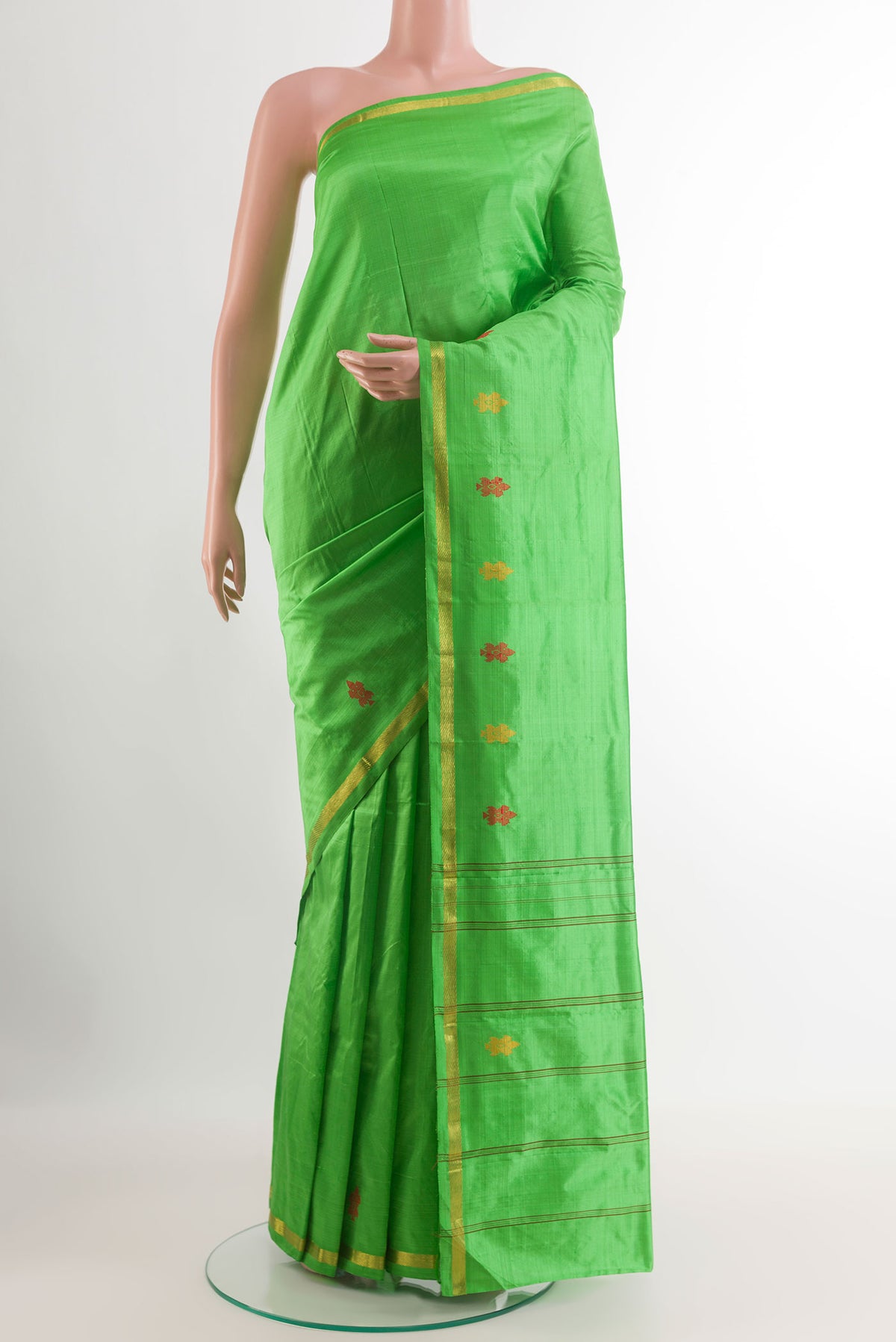 Green Kanchipuram Silk Saree with Plain Body and Zari Border.  displayed on a mannequin