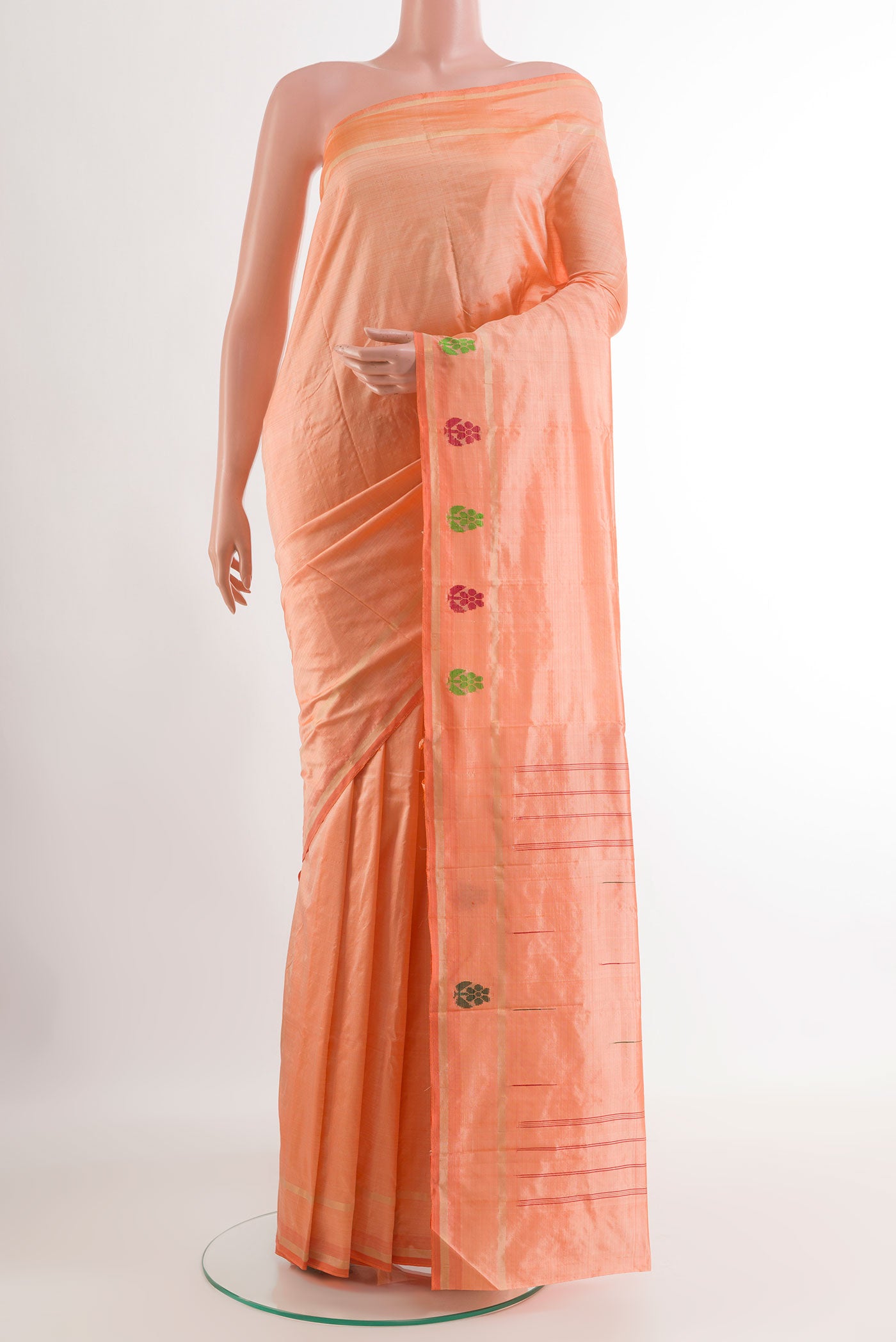 Peach Kanchipuram Silk Saree with Plain Body and Zari Border.  displayed on a mannequin