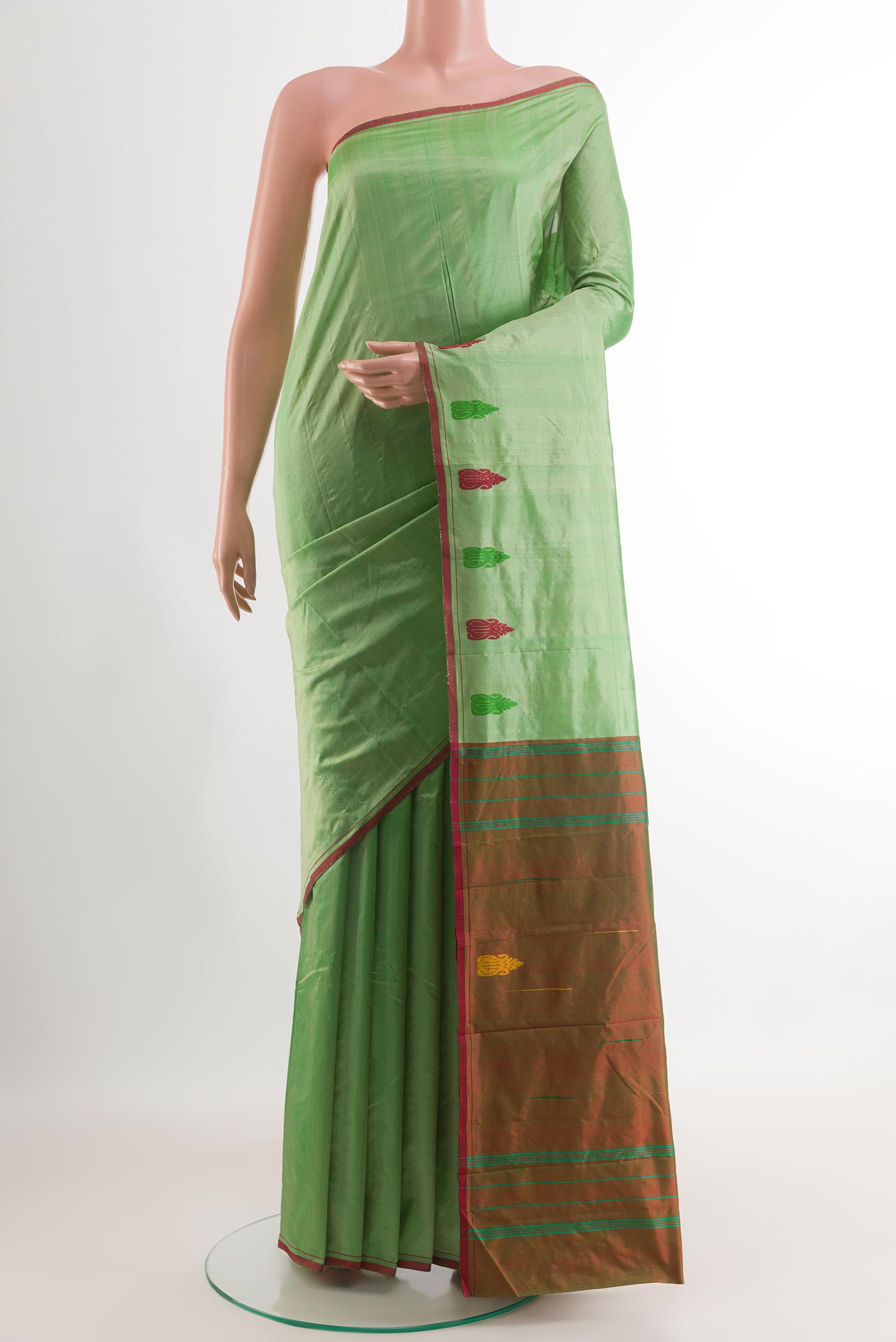 Mint Green Kanchipuram Silk Saree with Plain Body and Thread Border.  displayed on a mannequin