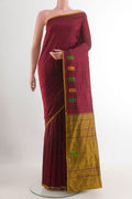 Maroon Kanchipuram Silk Saree with Plain Body and Zari Border.  displayed on a mannequin