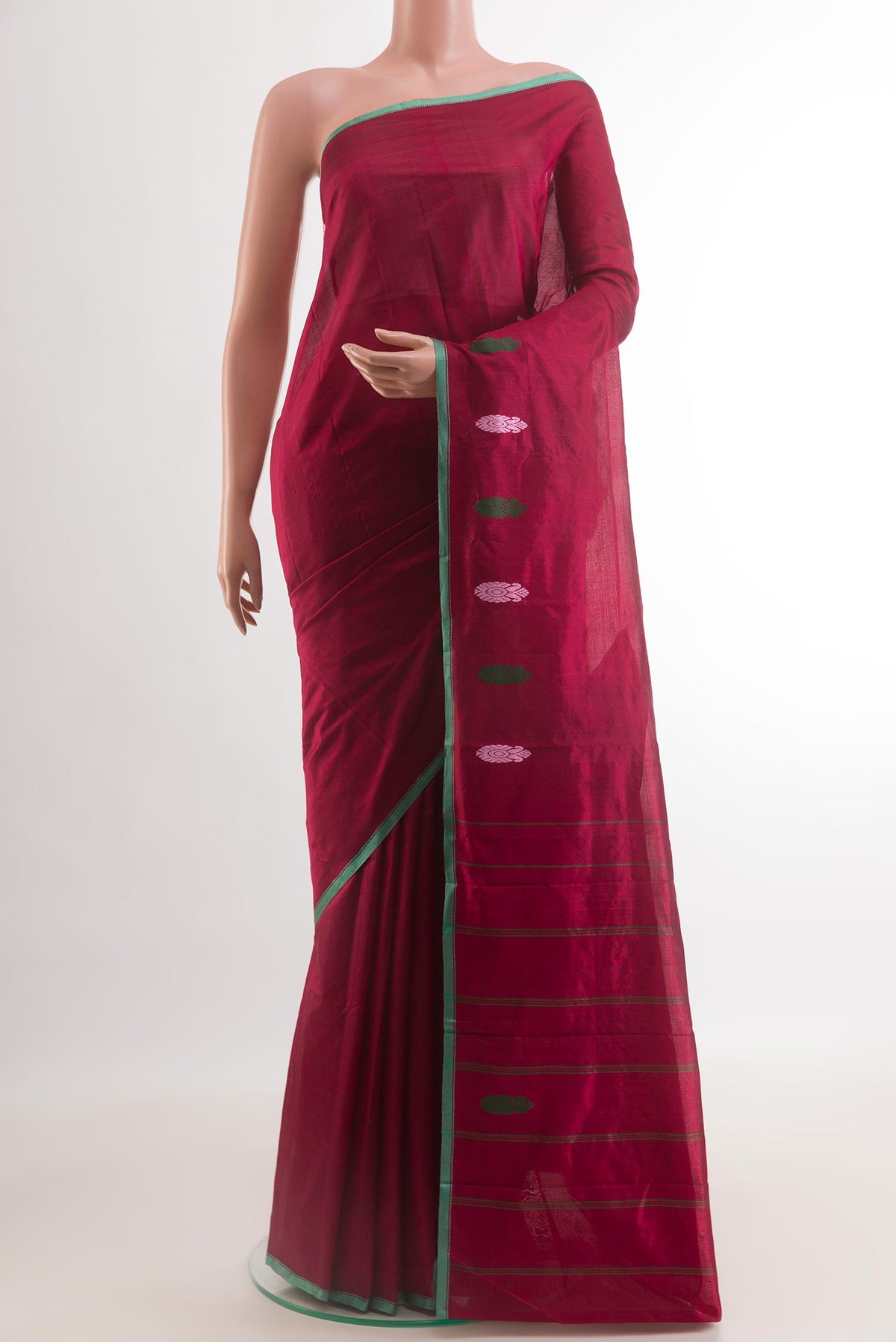 Maroon Kanchipuram Silk Saree with Plain Body and Thread Border.  displayed on a mannequin