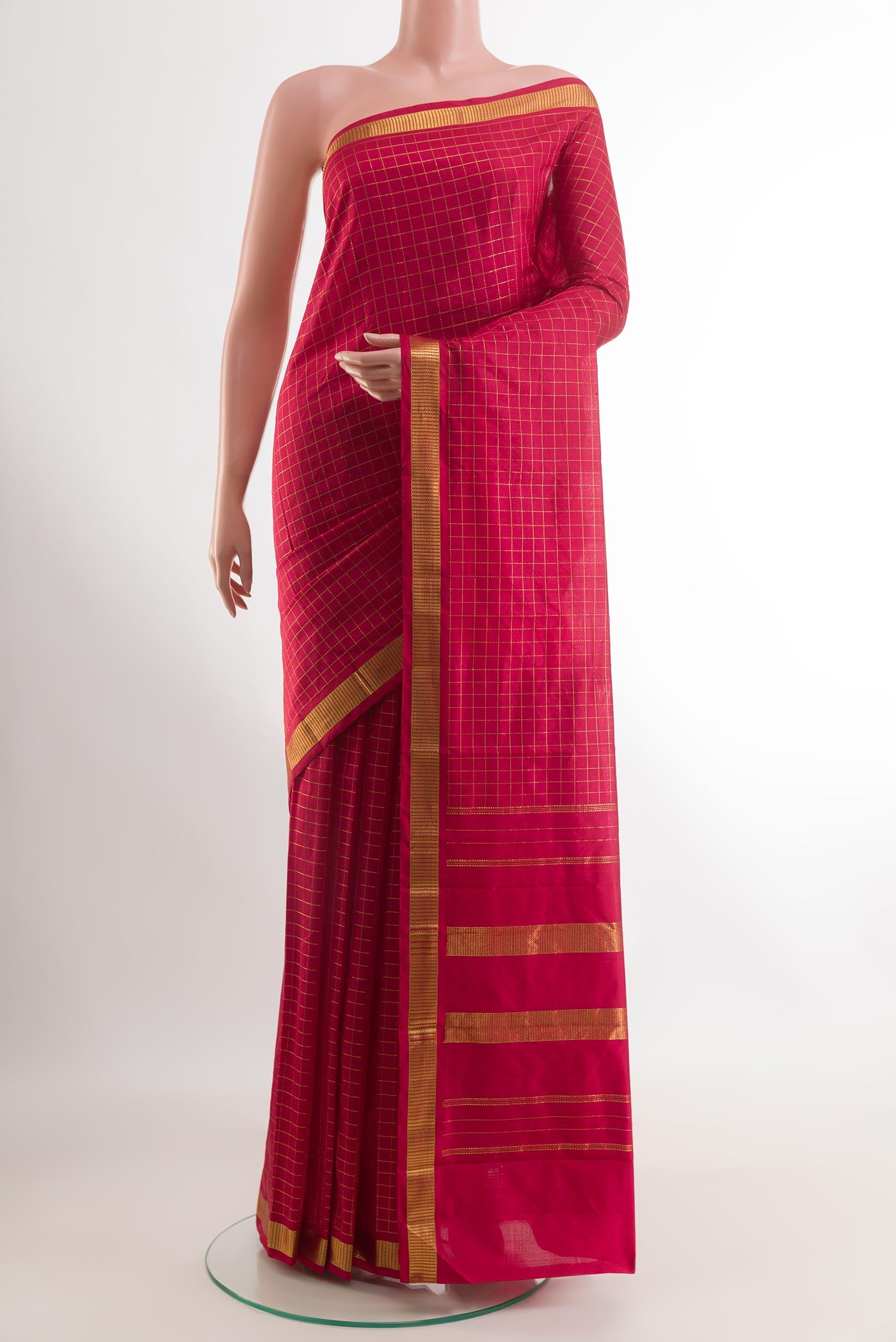 Red Kanchipuram Silk Saree with Checked design on the body and Zari Border.  displayed on a mannequin