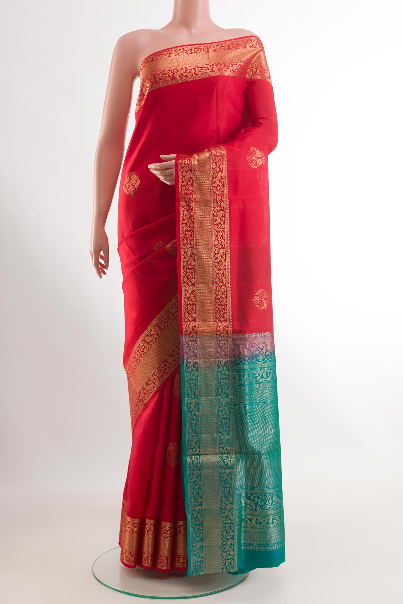 Red Soft Silk Saree with Zari Butta on the body and Zari Border.  displayed on a mannequin