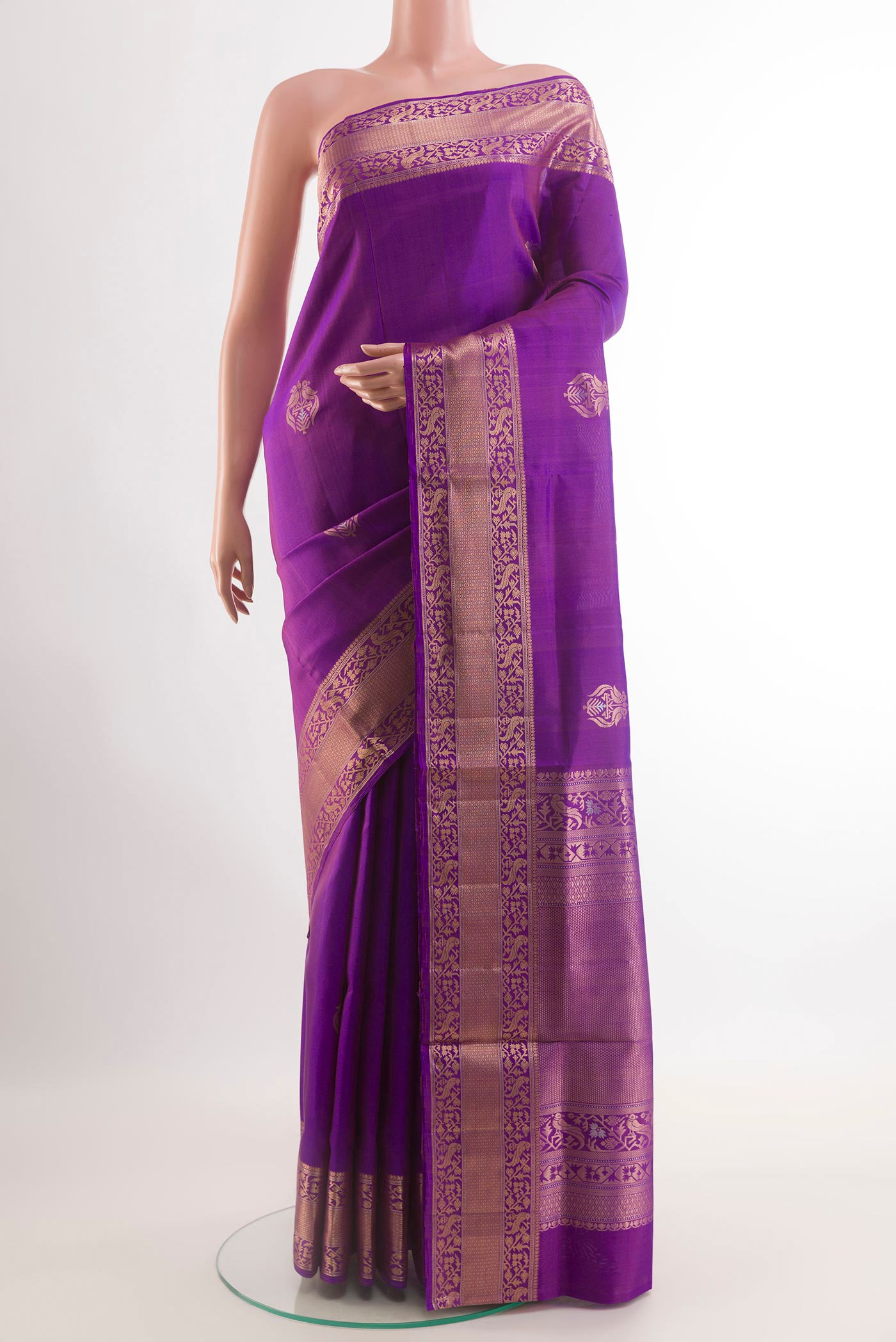 Purple Soft Silk Saree with Zari Butta on the body and Zari Border.  displayed on a mannequin