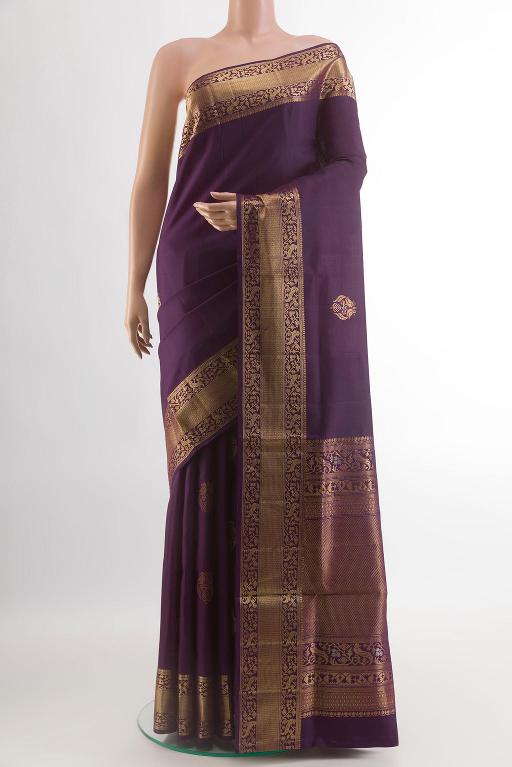 Purple Soft Silk Saree with Zari Butta on the body and Zari Border.  displayed on a mannequin