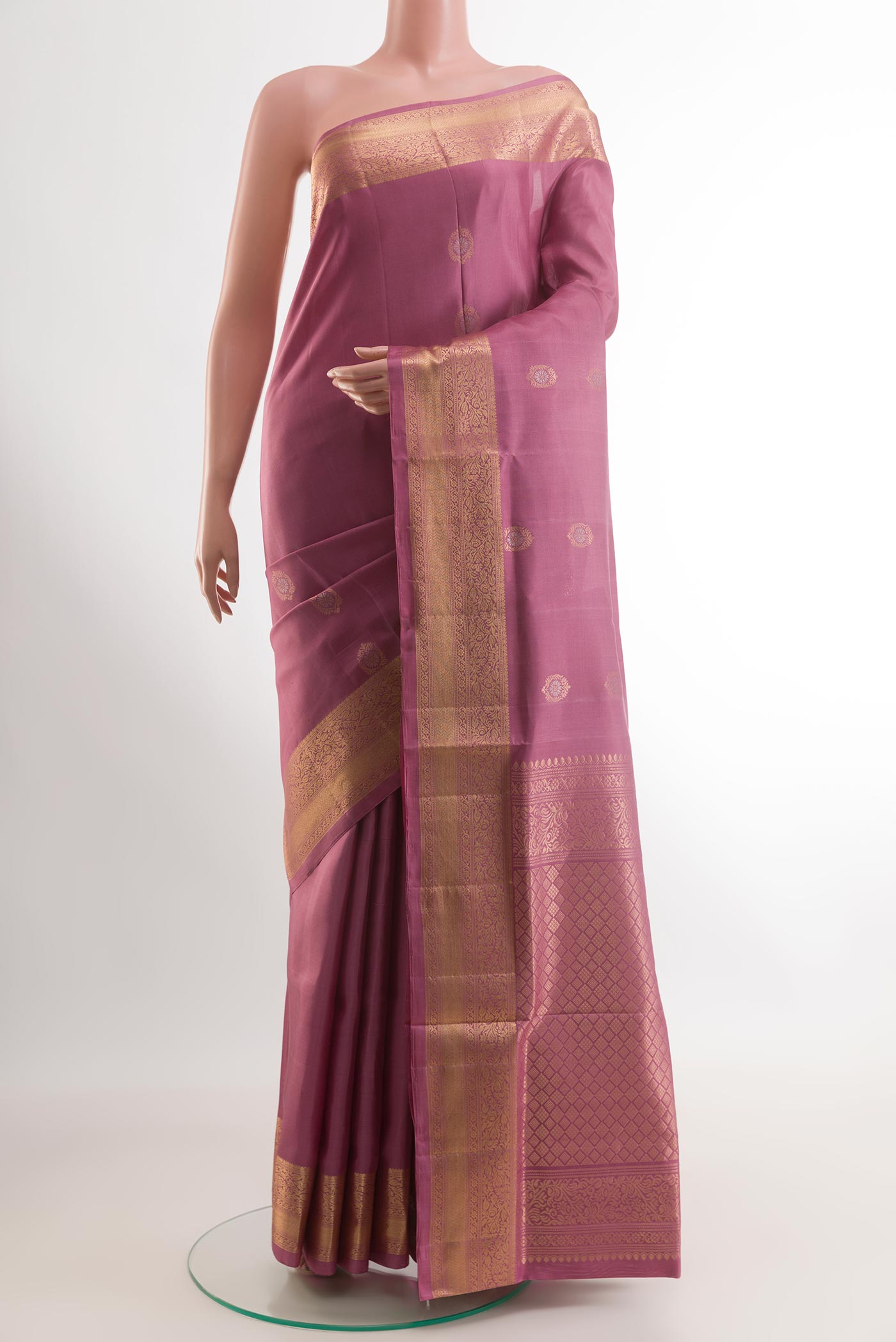 Imperial Pink Soft Silk Saree with Zari Butta on the body and Zari Border.  displayed on a mannequin