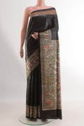 Black Tussar Silk Saree with Plain Body and Printed Border.  displayed on a mannequin