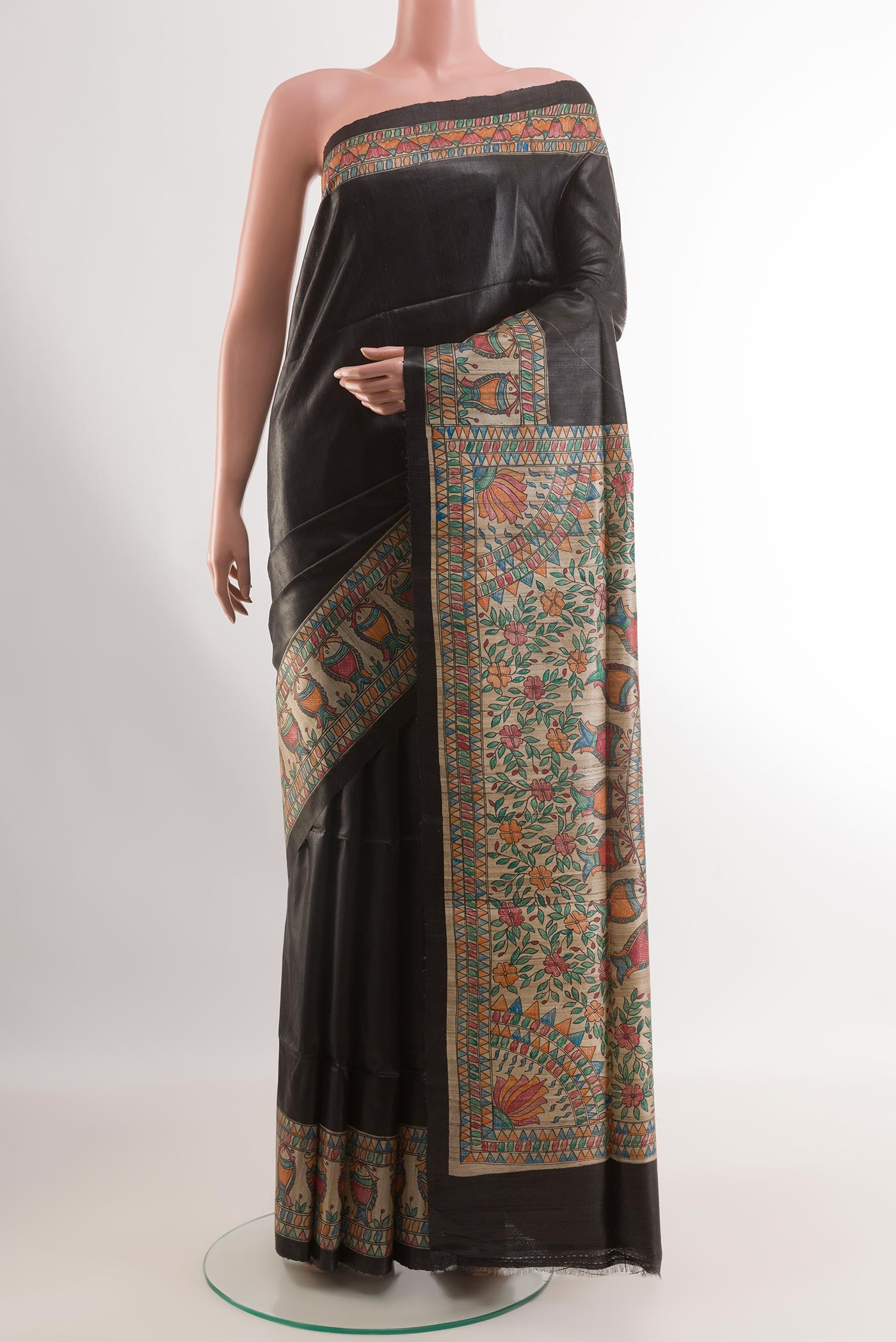 Black Tussar Silk Saree with Plain Body and Printed Border.  displayed on a mannequin