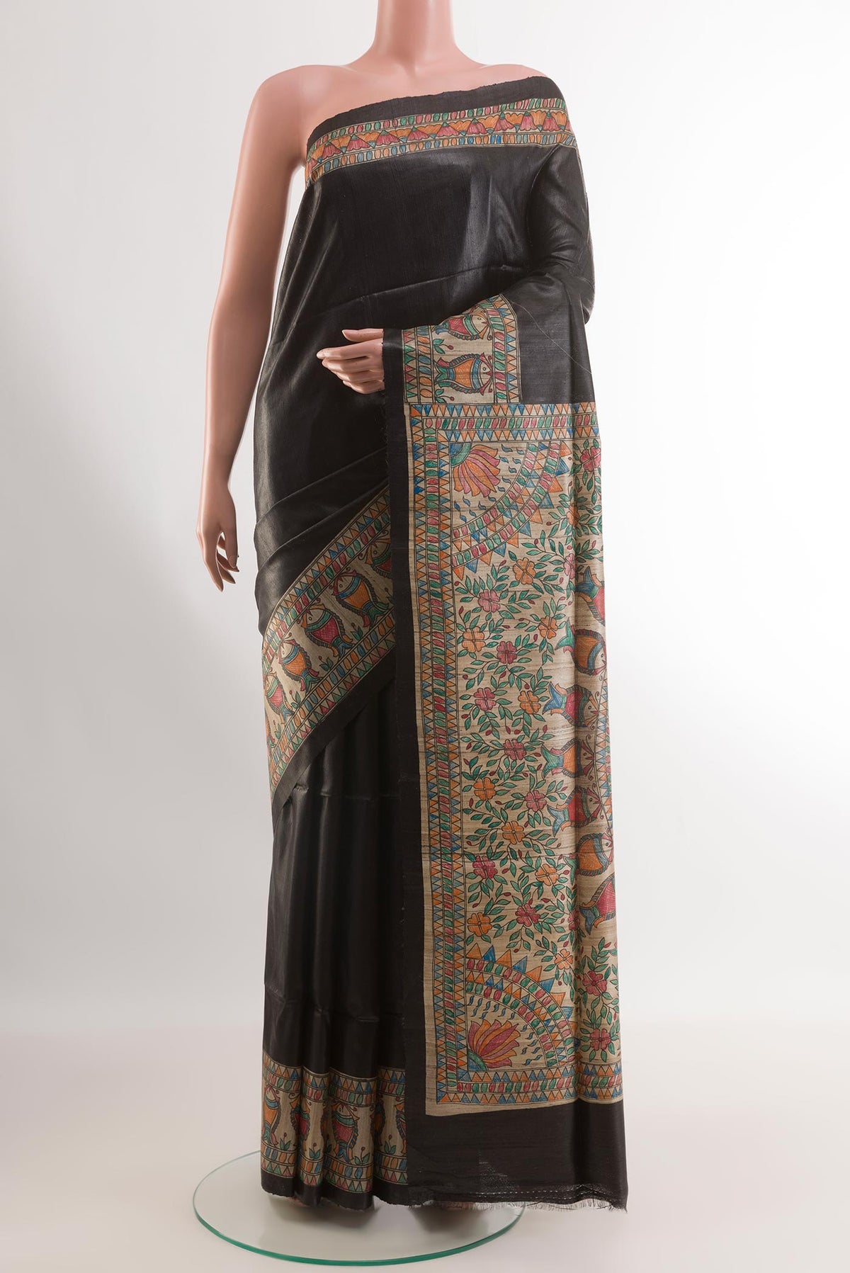 Black Tussar Silk Saree with Plain Body and Printed Border.  displayed on a mannequin
