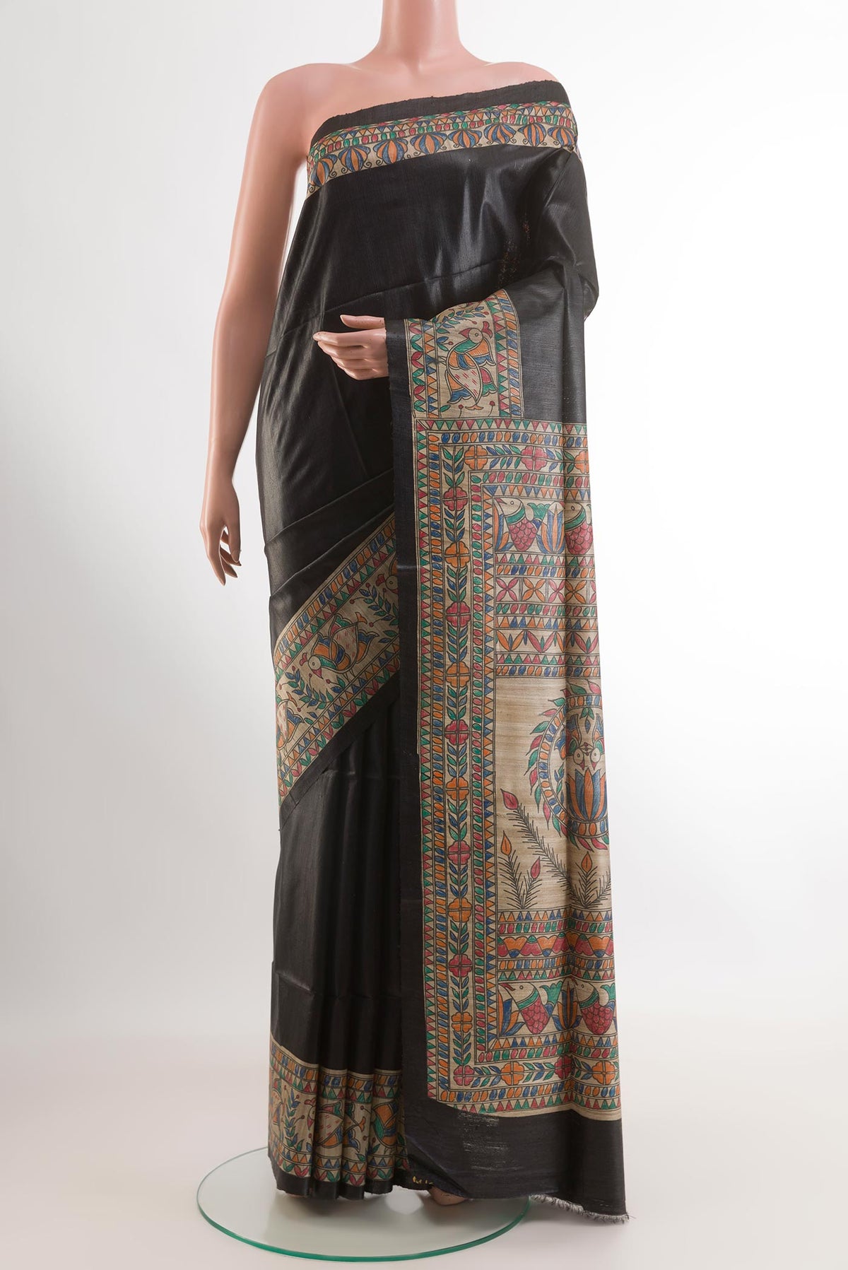 Black Tussar Saree with Plain Body and Printed Border.  displayed on a mannequin