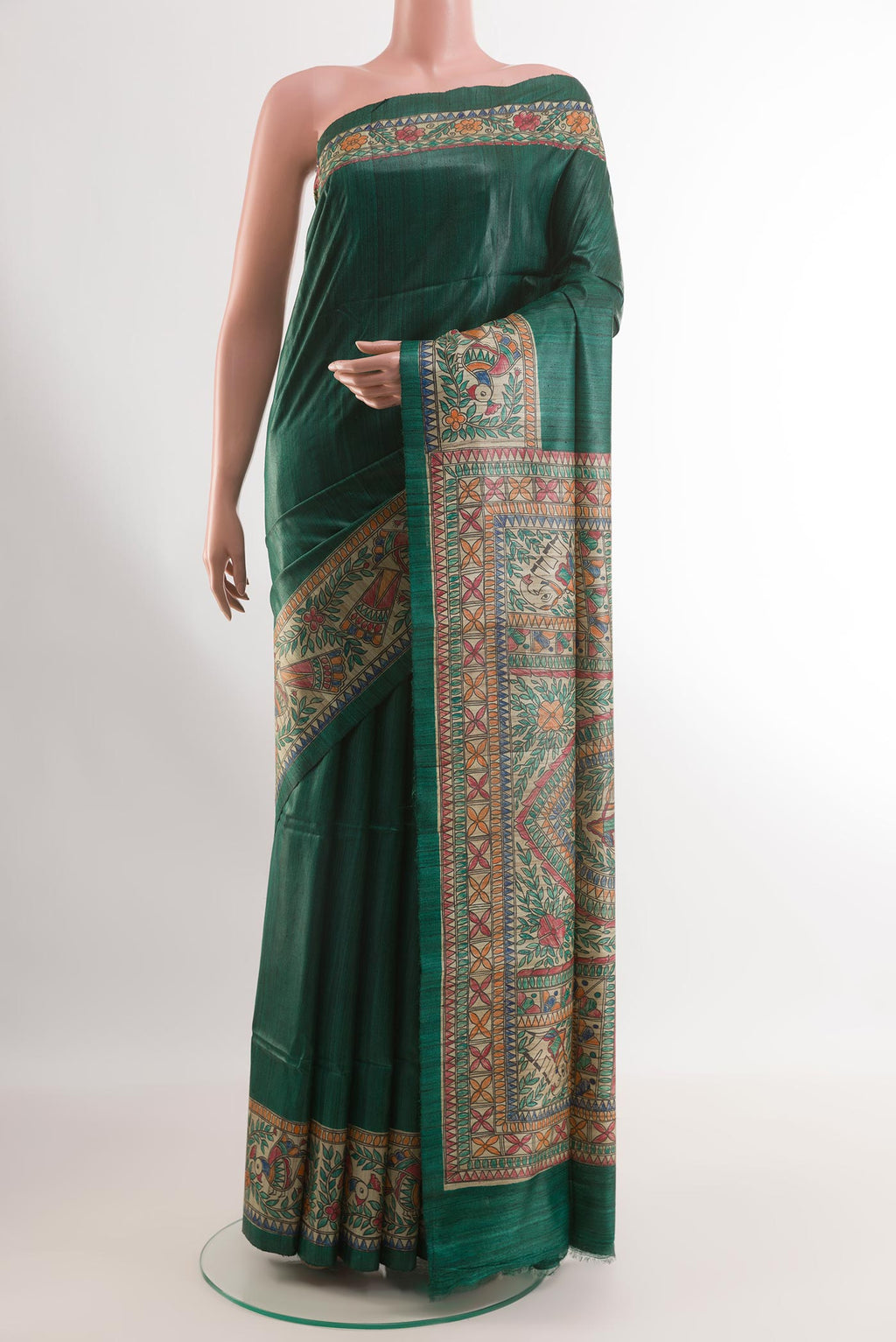 Green Tussar Silk Saree with Plain Body and Printed Border.  displayed on a mannequin