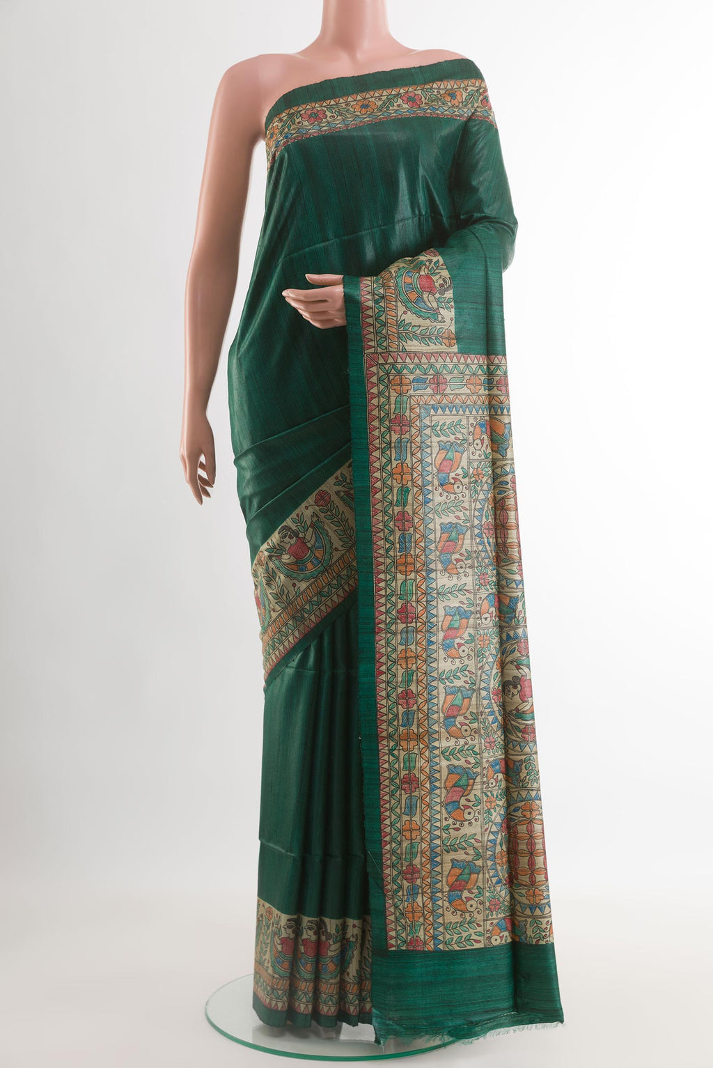 Bottle Green Tussar Silk Saree with Plain Body and Printed Border.  displayed on a mannequin