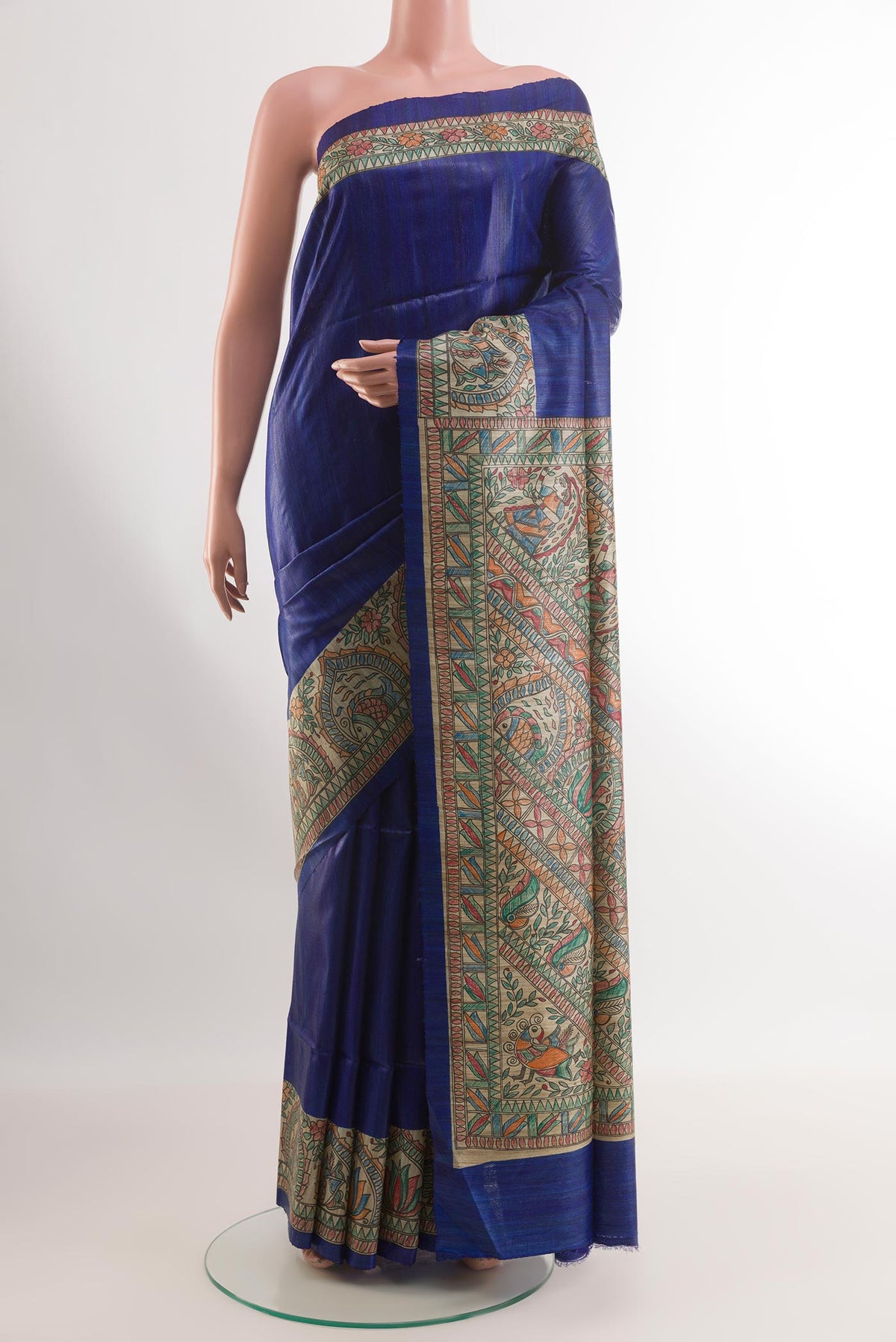 Blue Tussar Silk Saree with Plain Body and Printed Border.  displayed on a mannequin